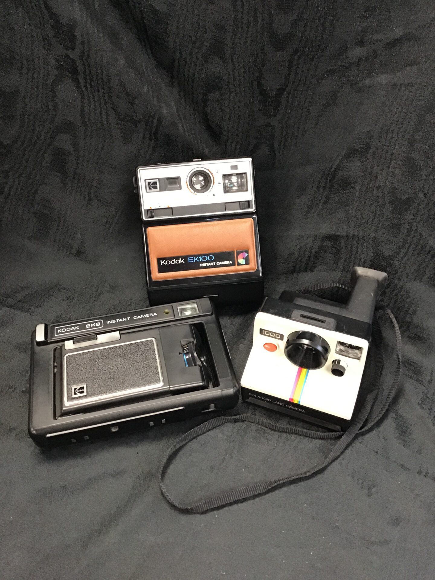 three polaroid camera