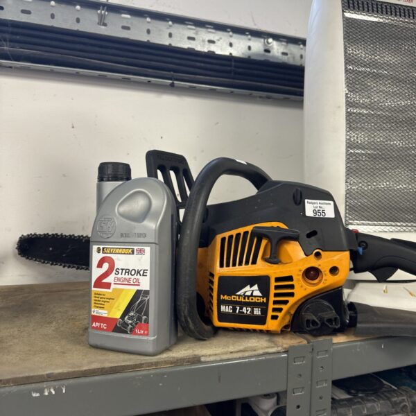 Vintage McCulloch Mac 7-42 petrol chainsaw with oil.