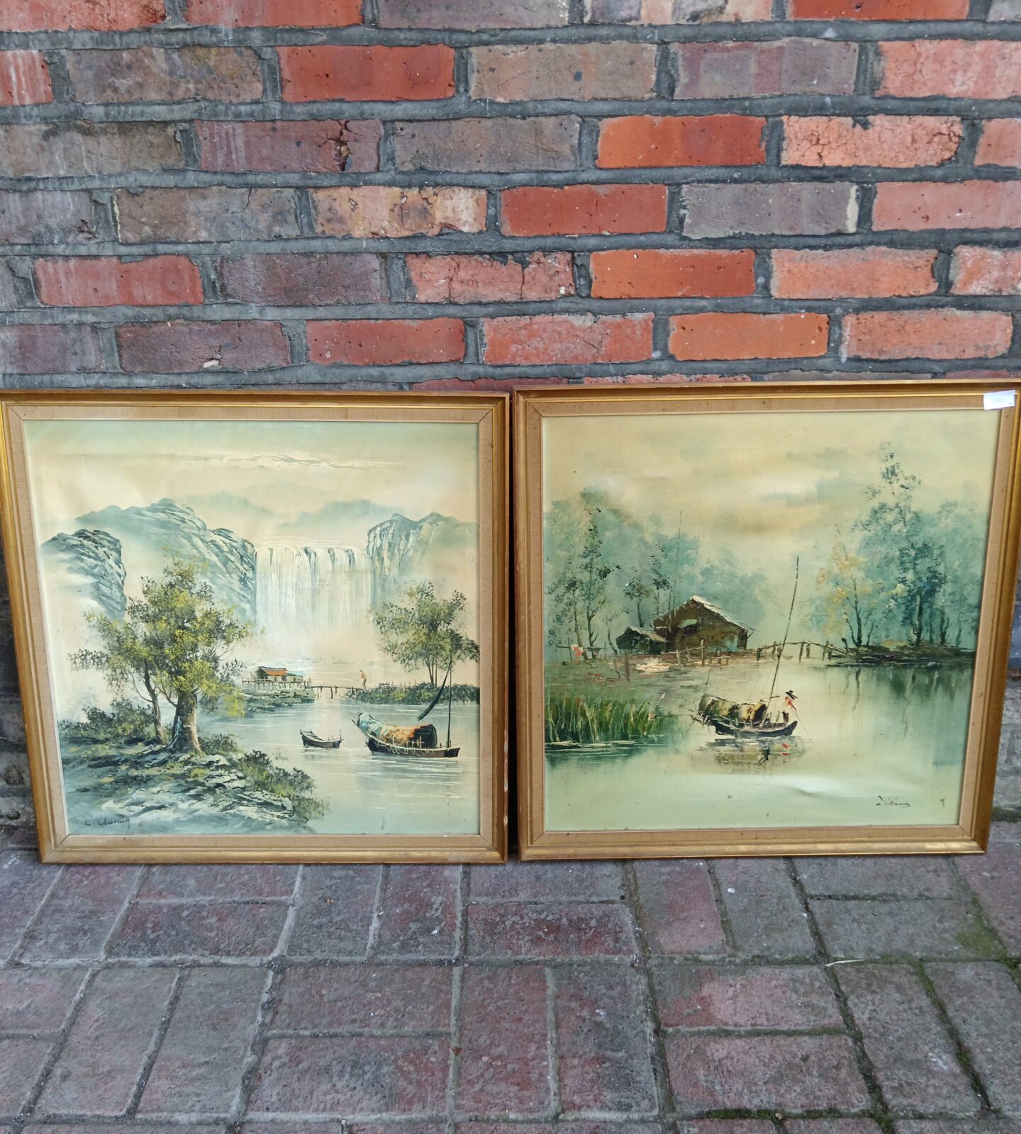 Pair of signed oriental oil paintings of fishing boats