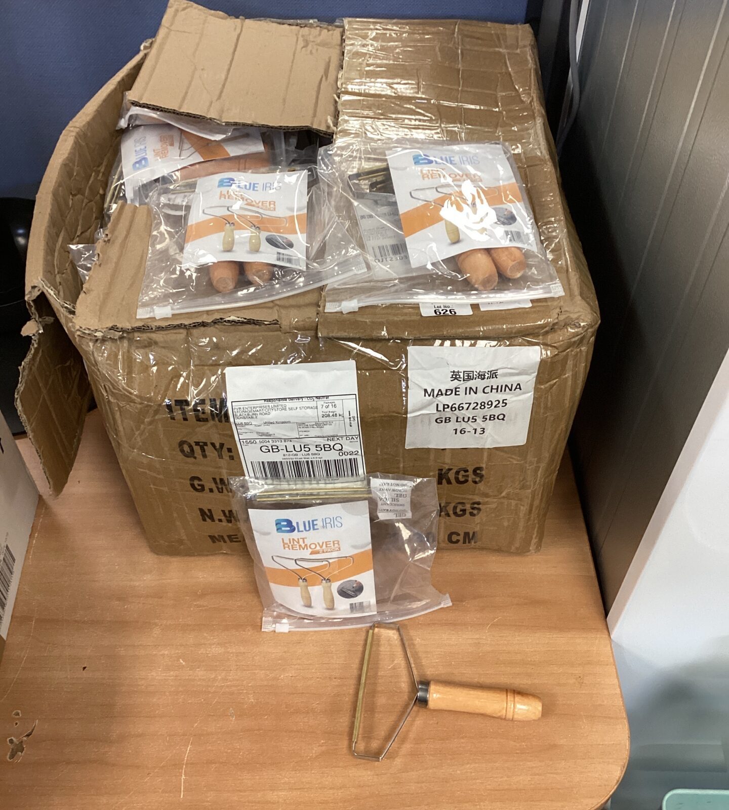 Very large quantity of blue iris lint removers new in bags