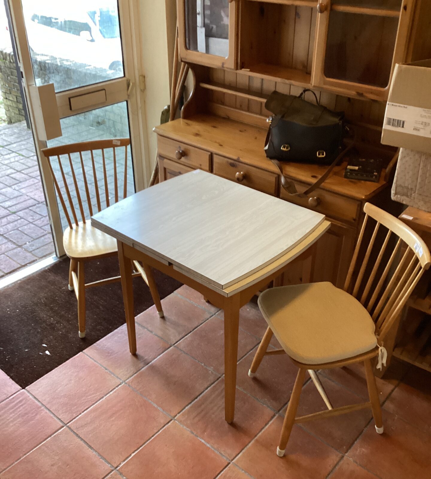Formica Extending Table and two pine chairs