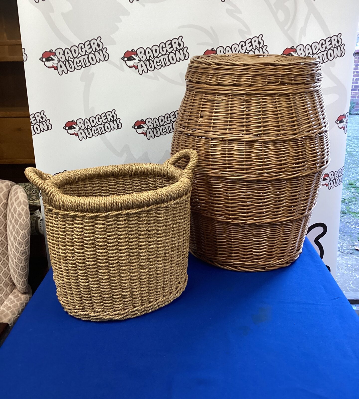 Two wicker baskets inc laundry basket
