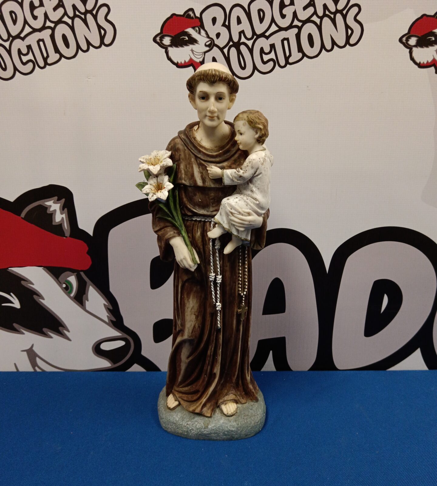 Resin sculpture of a monk & child