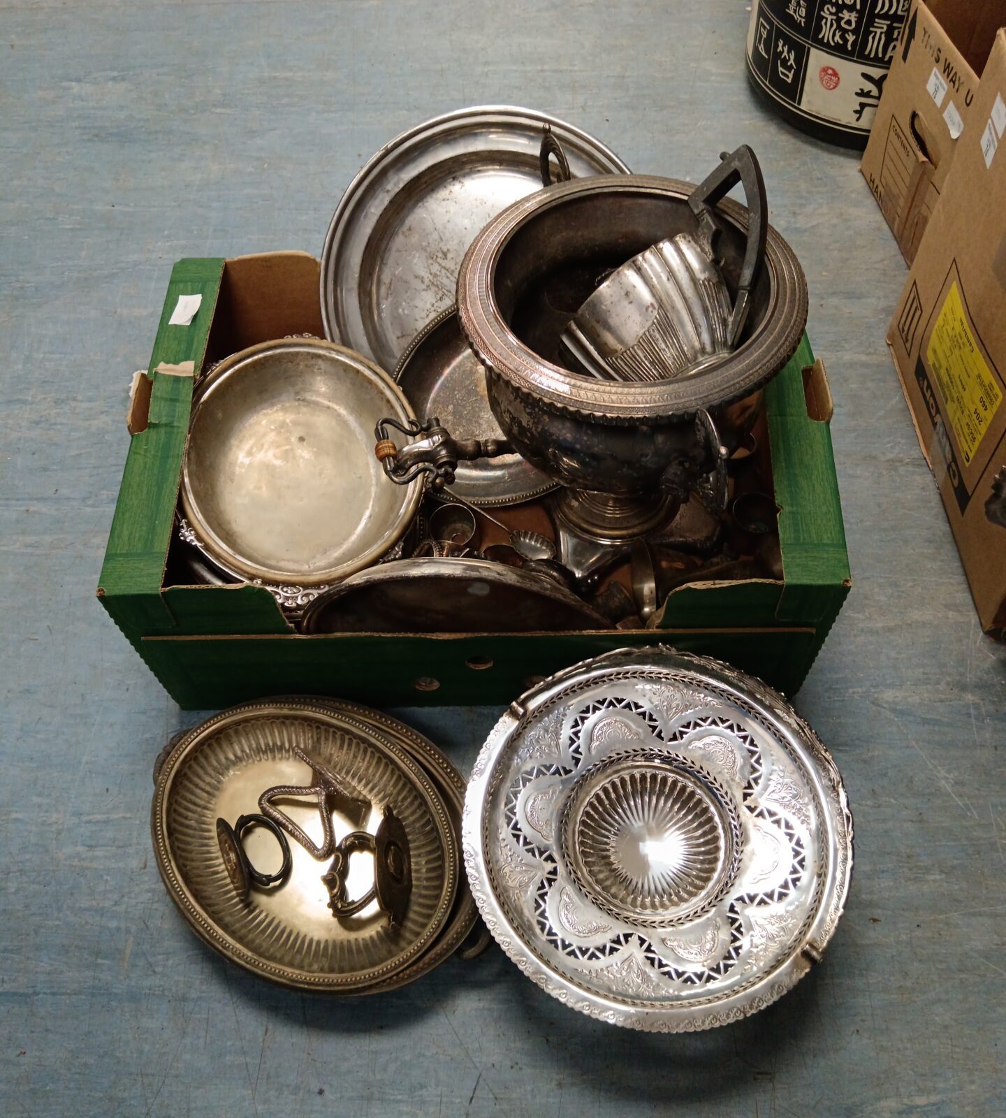 Large box of silver plate including serving trays & water urn