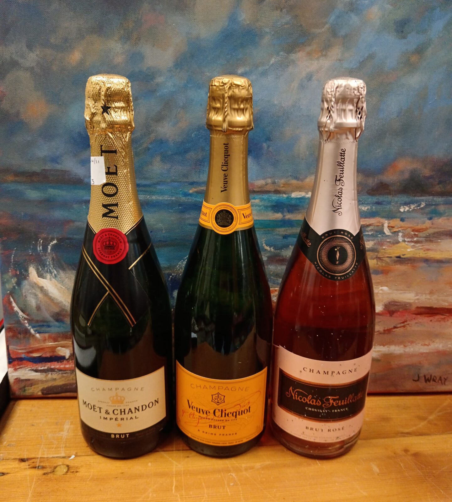 Three bottles of champagne including veuve clicquot & moet chandon