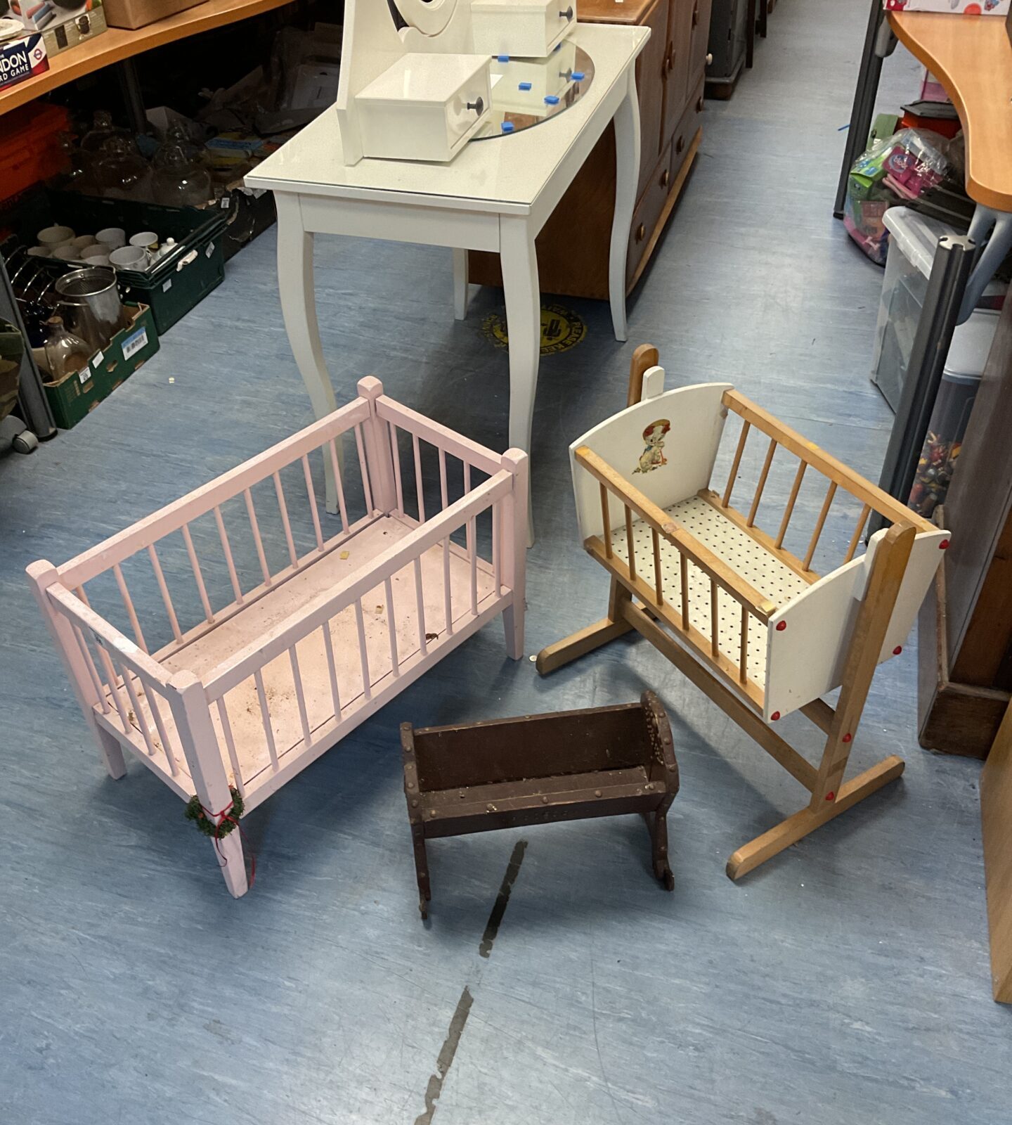 Three vintage childs doll cots