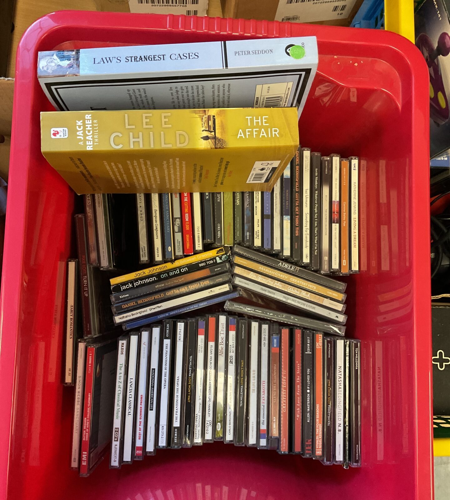 Collection of CDs and books including Adele, Mariah Carey and Frank Sinatra