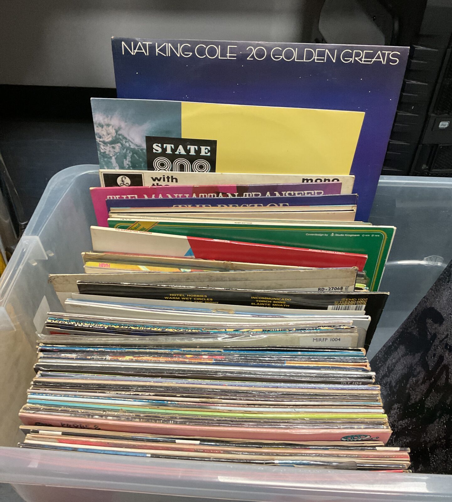 Large collection of 12” vinyl records including Nat King Cole and Glenn Miller