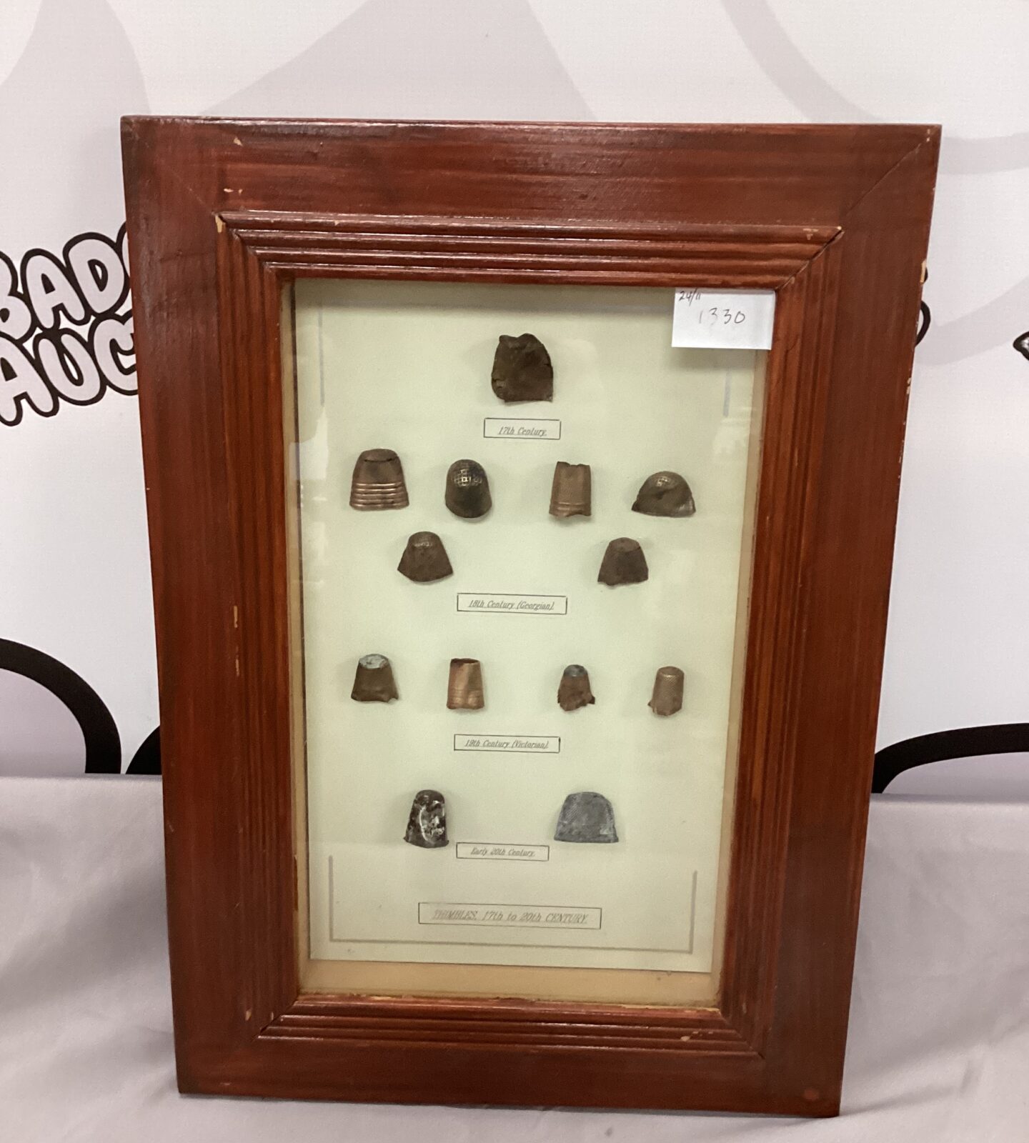 Framed and mounted antique thimbles