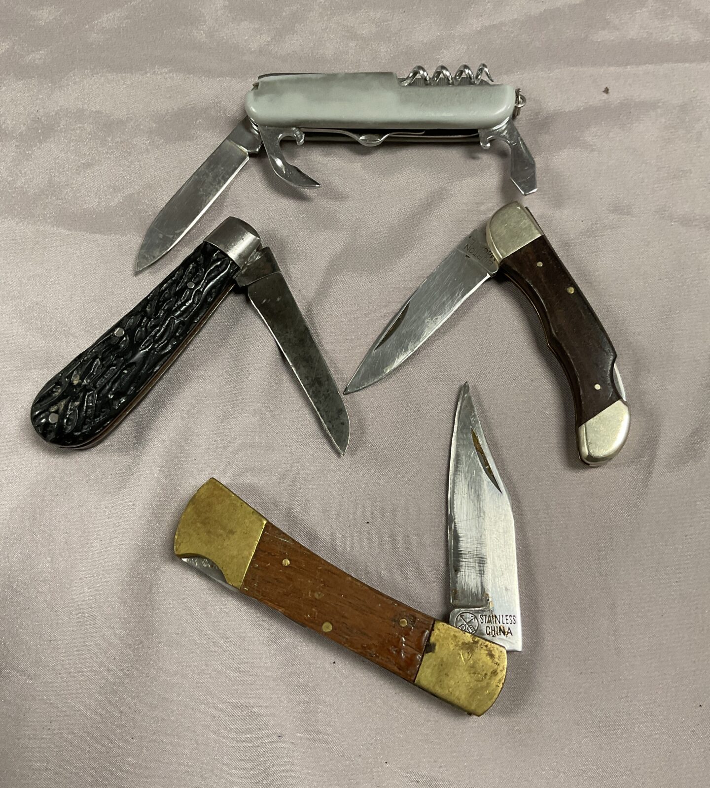 Four vintage pocket knives