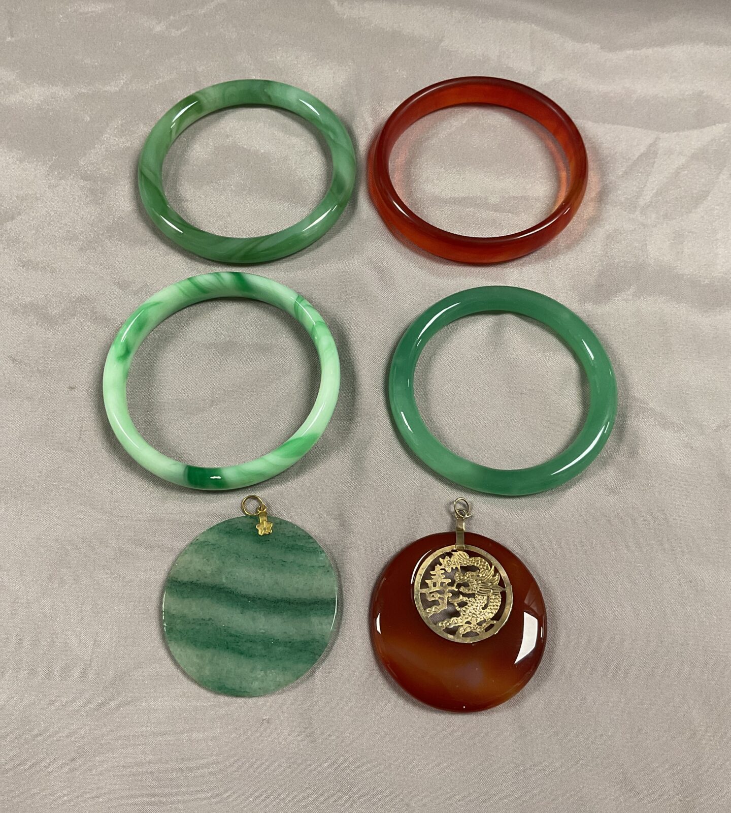 Four Jade bangles and two pendants