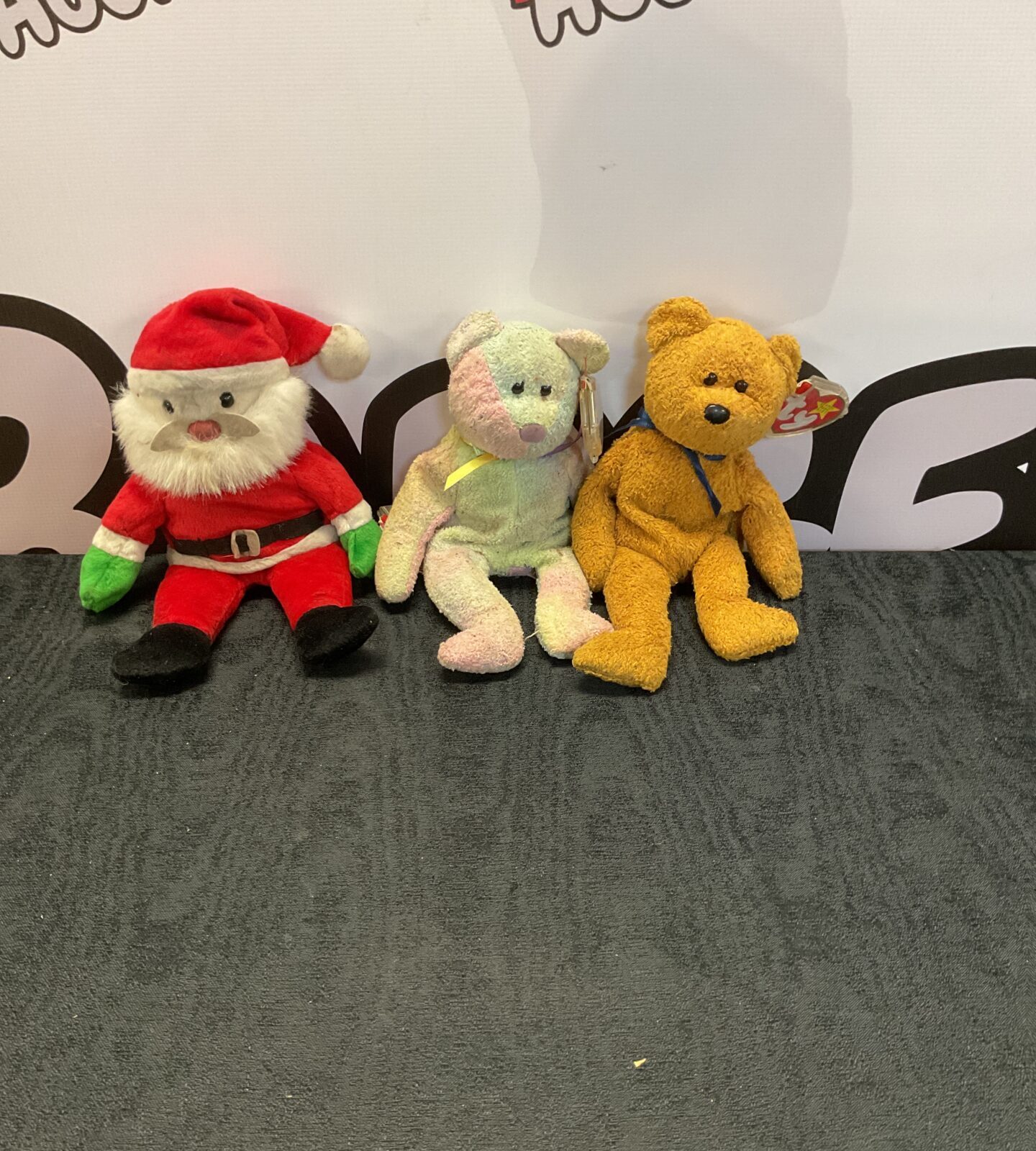 Three beanie baby teddies inc Santa