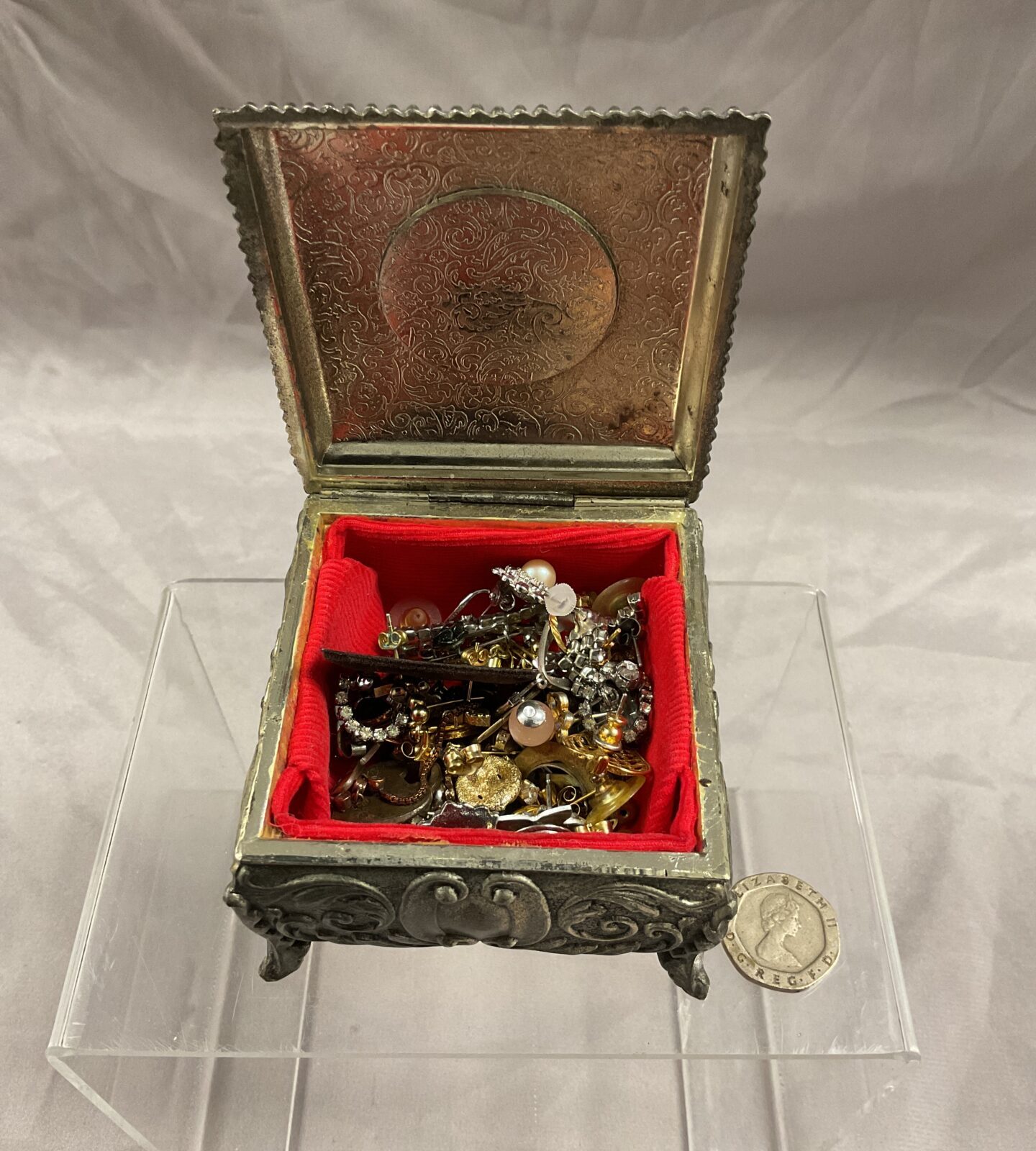 cameo lidded jewellery box with assorted earrings