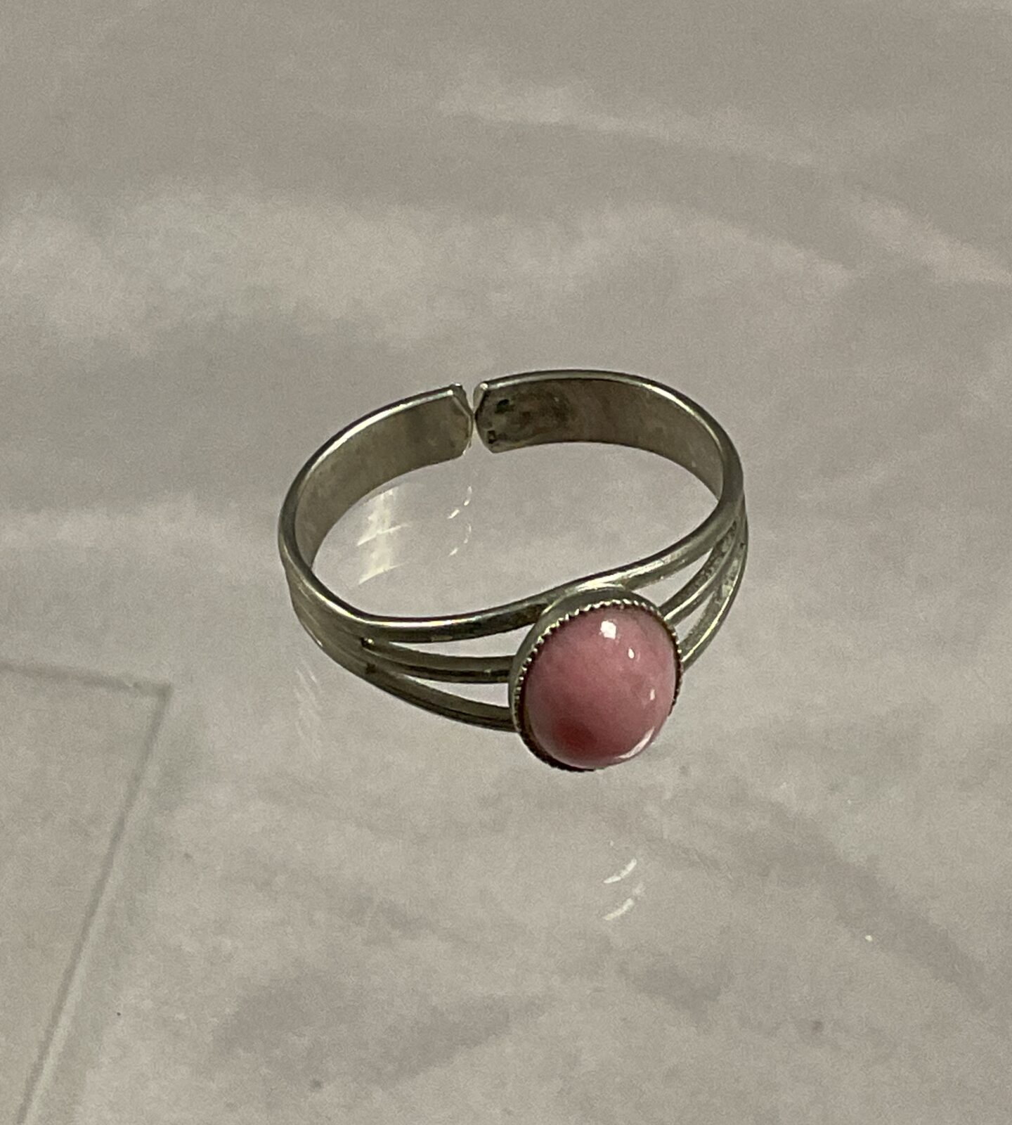 Silver tone ring set with pink stone Size R