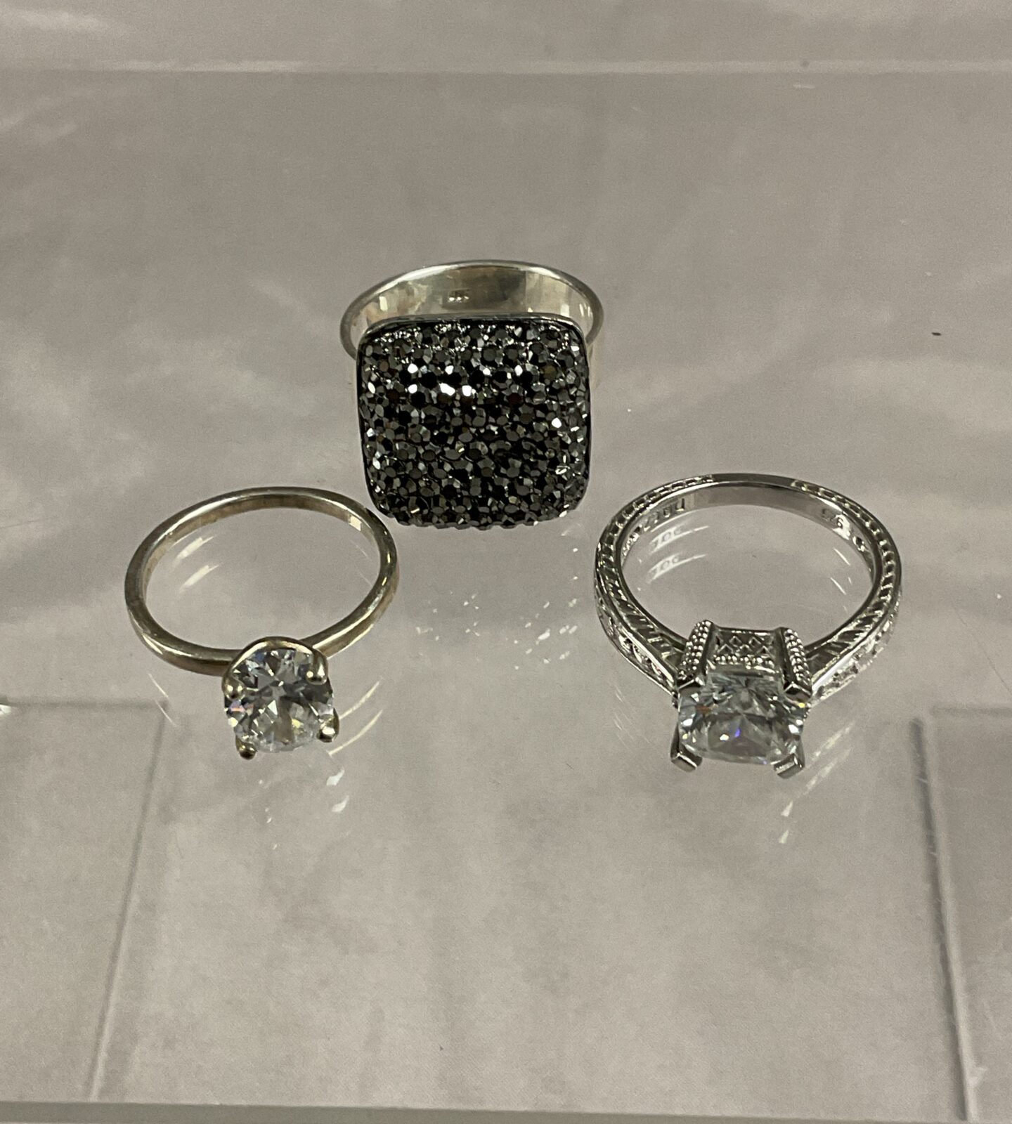 Three 925 silver stone set rings sizes L N O