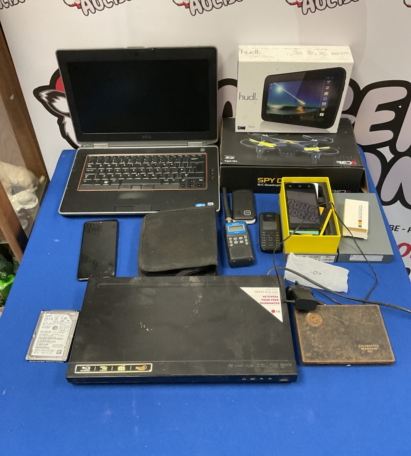 Job lot of mixed electricals including Dell Latitude i5 laptop (untested) hudl tablet, spy drone and various phones