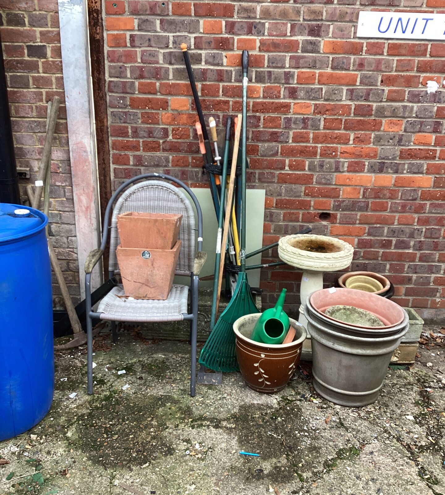 Job lot of garden planters, tools and garden furniture