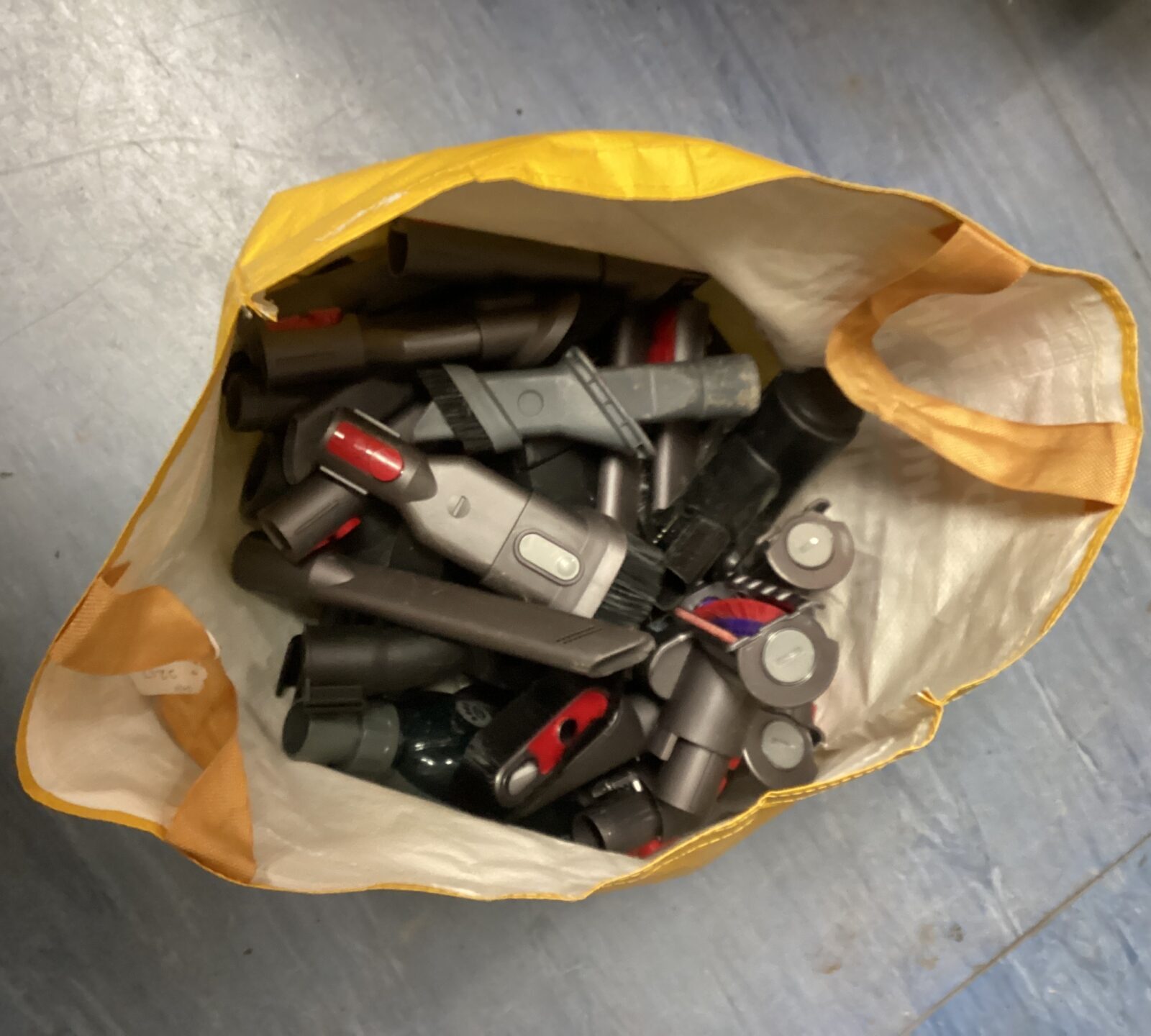 Bag of assorted dyson vacuum cleaner nozzles etc