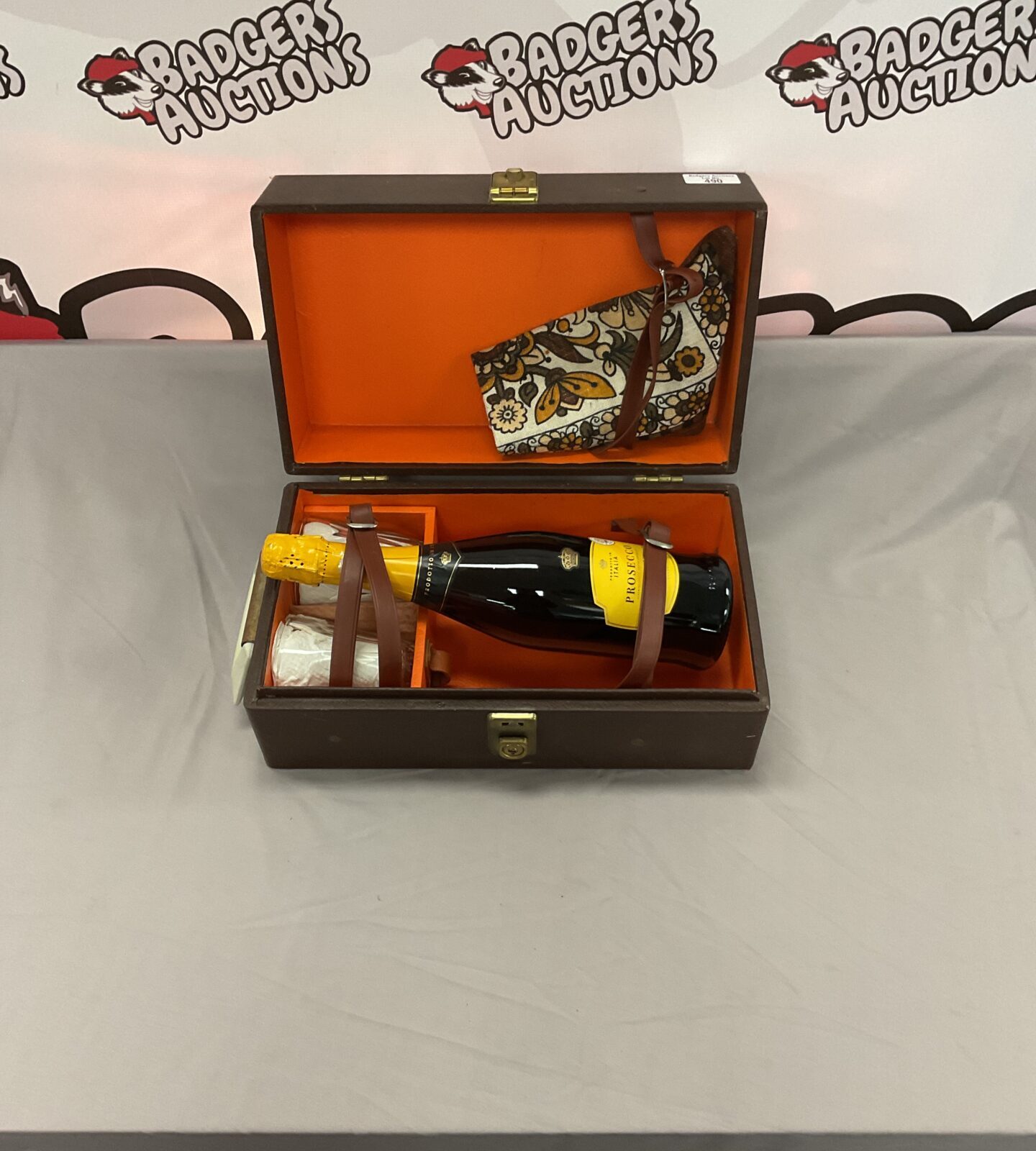 Leather box with a bottle of prosecco spumante champagne