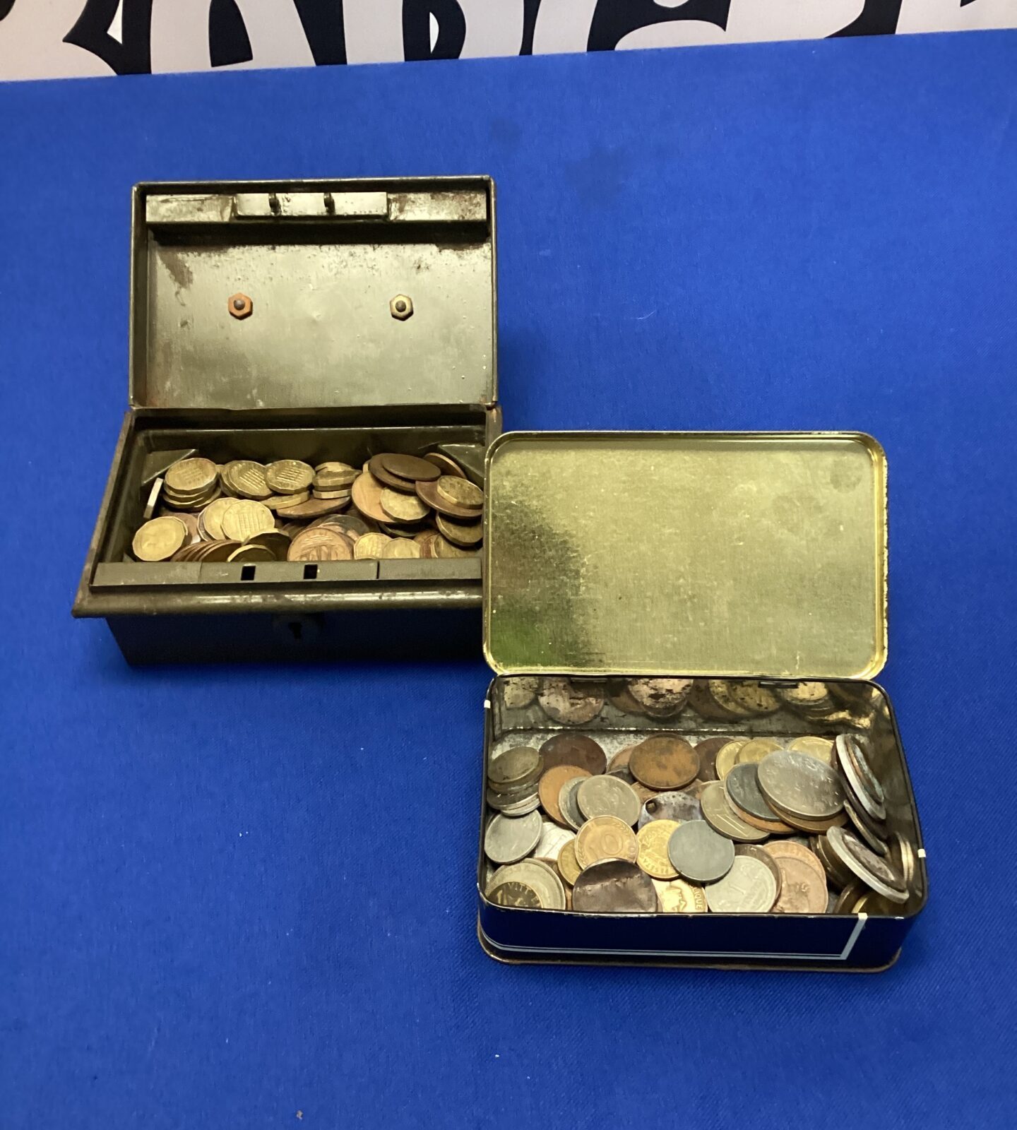 Two tins of assorted coins