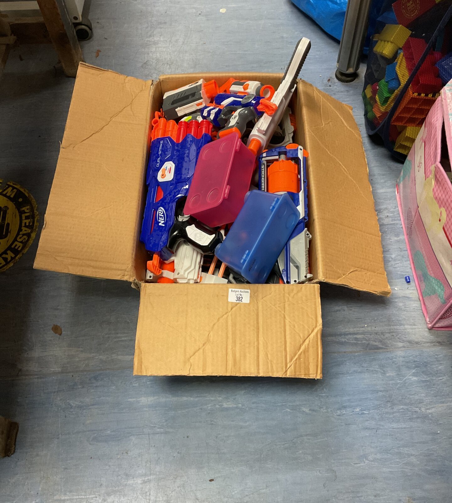 Box of nerf guns and ammo