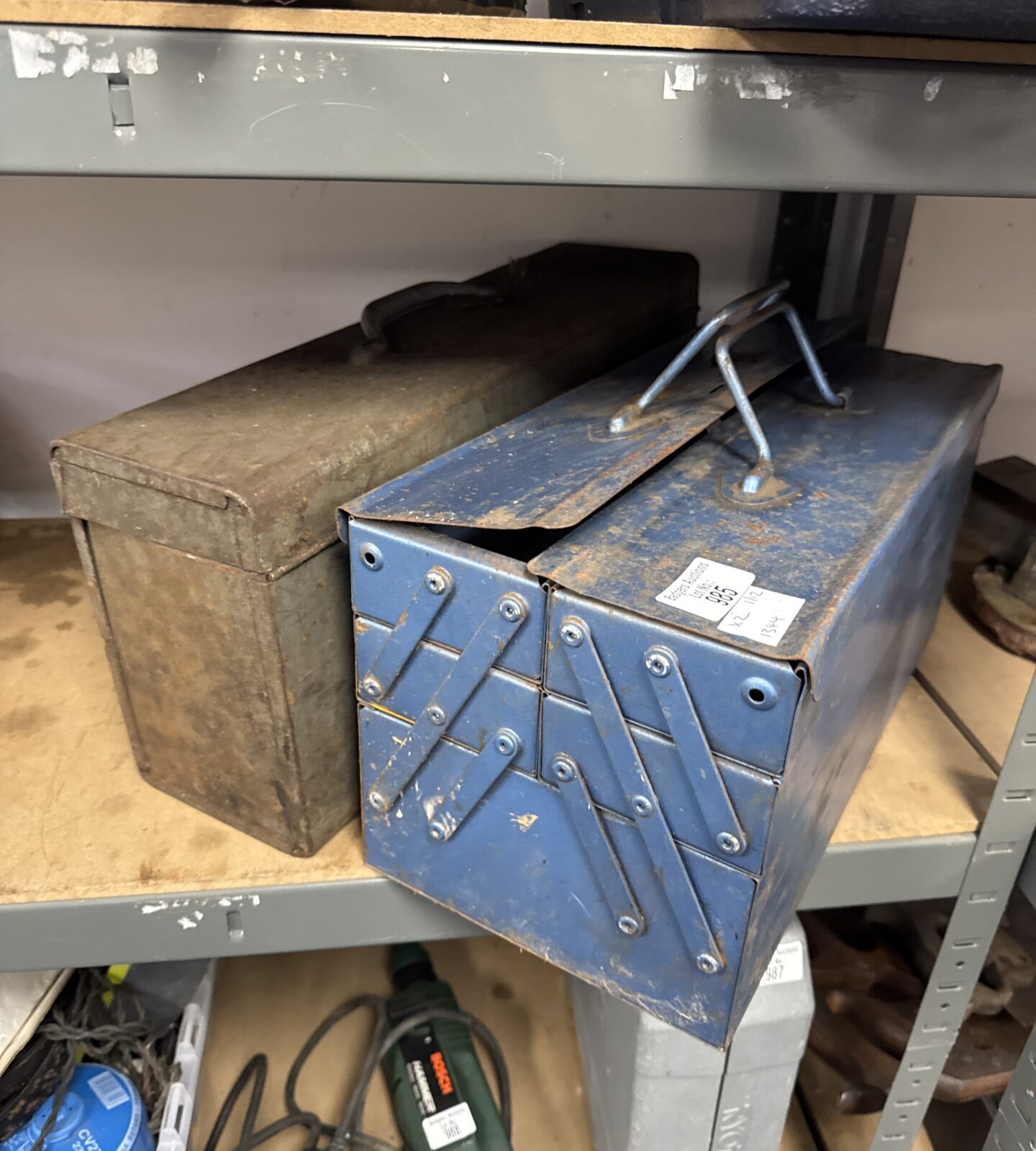 Empty skil saw box with empty cantilever toolbox