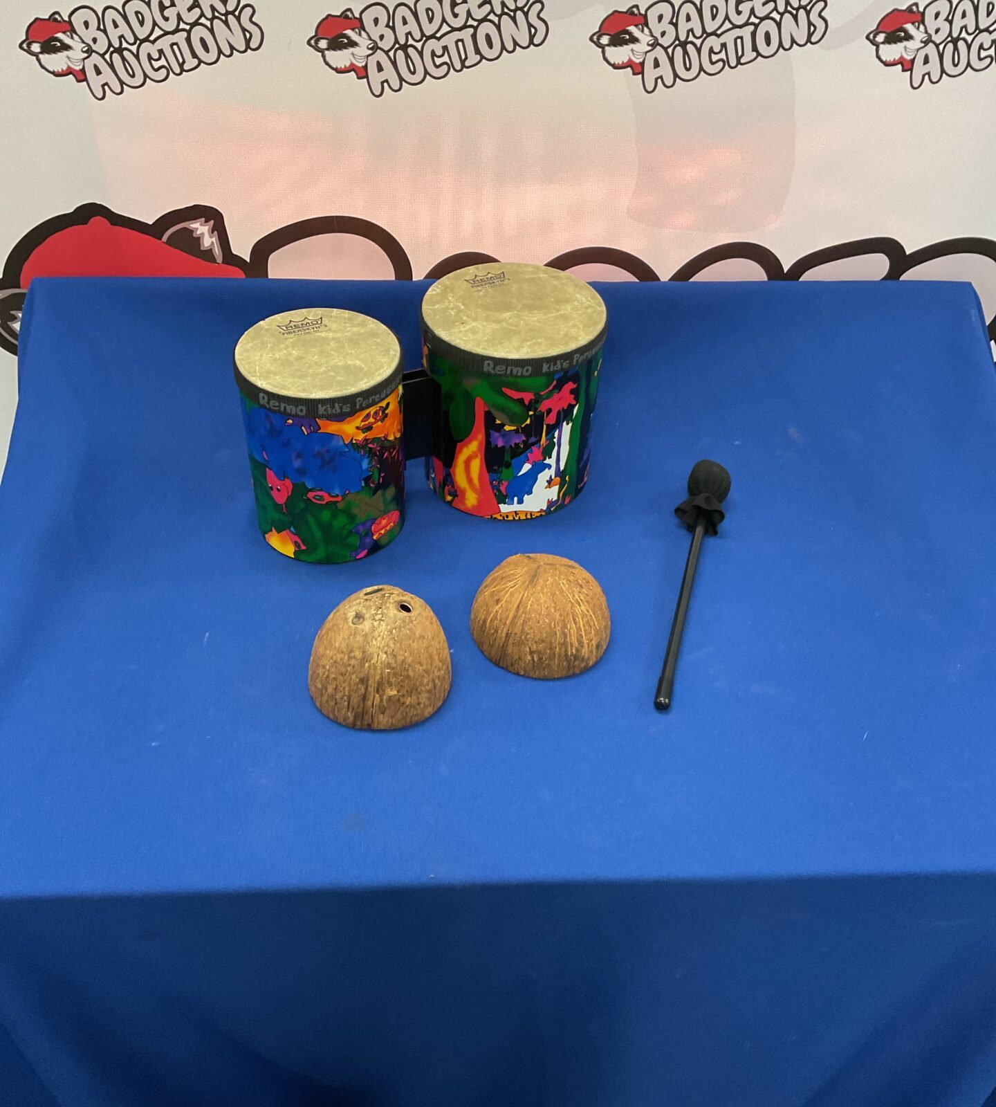 Two remo percussion drums with drumstick and percussion sound effect coconut