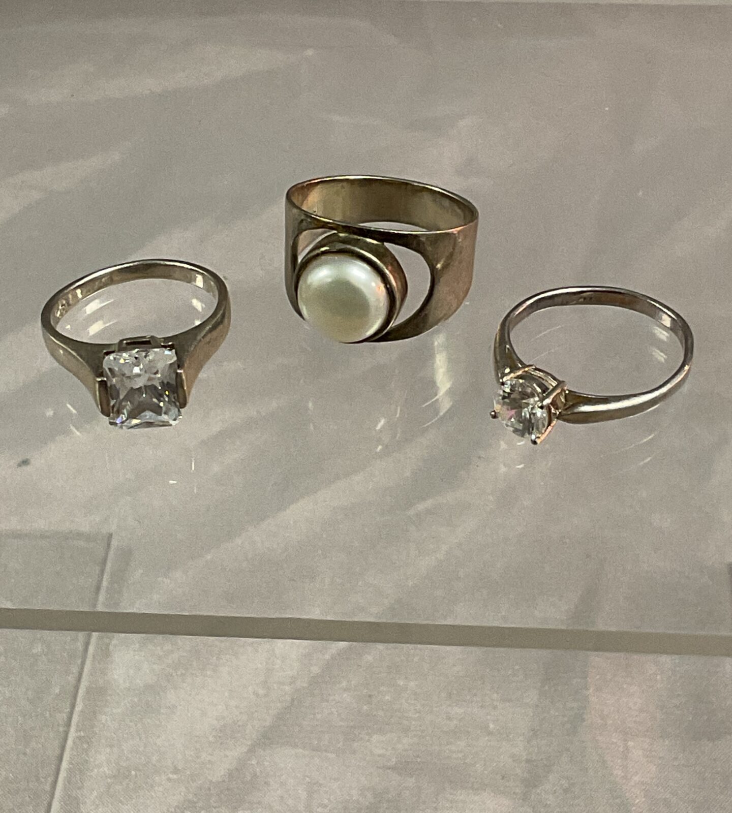 Three 925 silver stone set rings sizes K L O