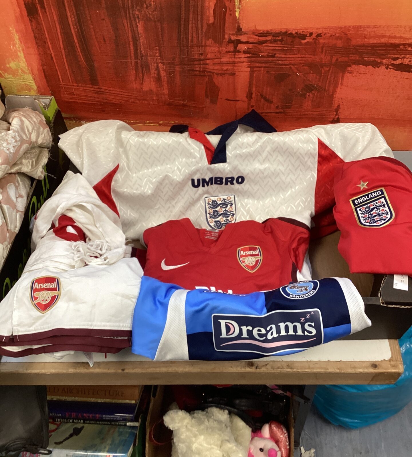 Tray of mixed childs football shirts inc Two childs england football shirts, wycombe wanderers shirt with arsenal shirt & shorts