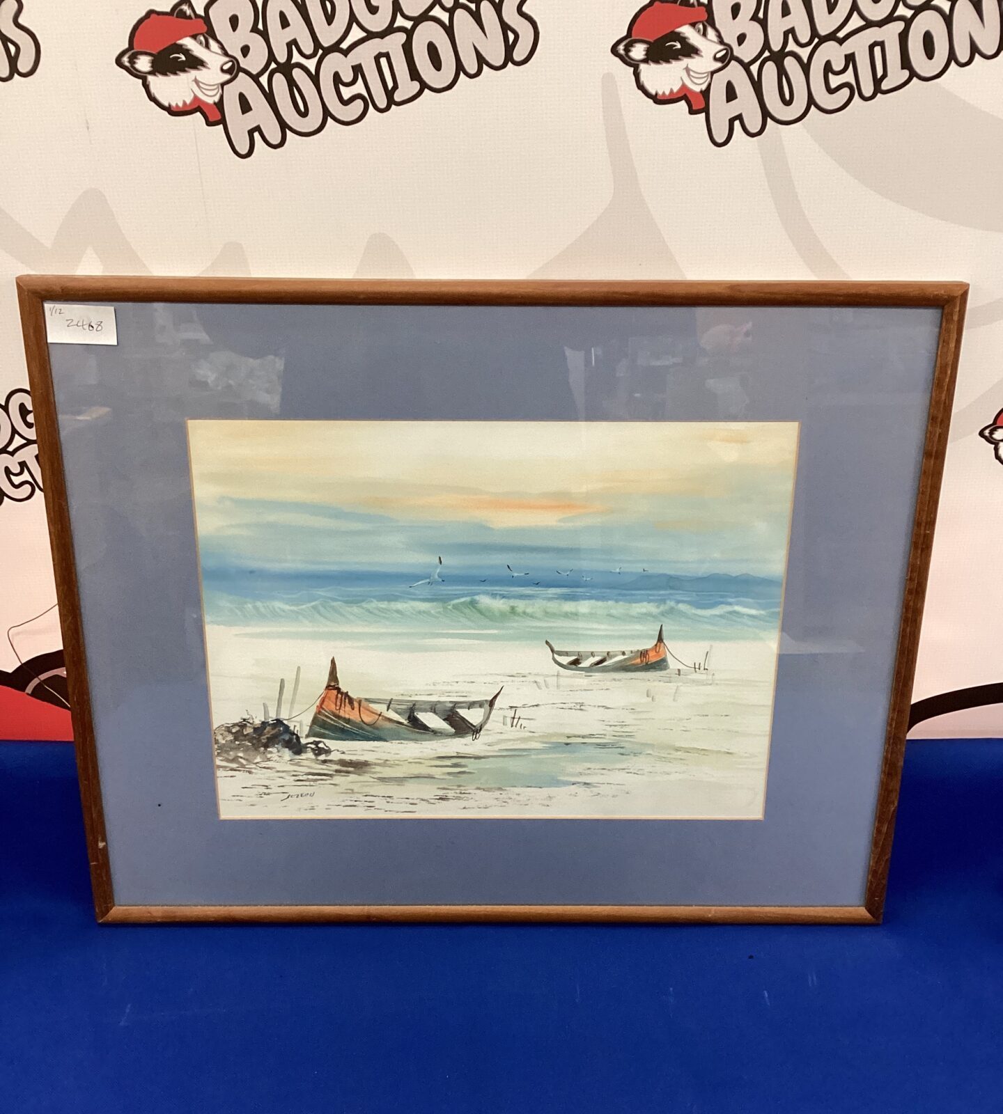 Signed watercolour seascape of fishing boats on beach