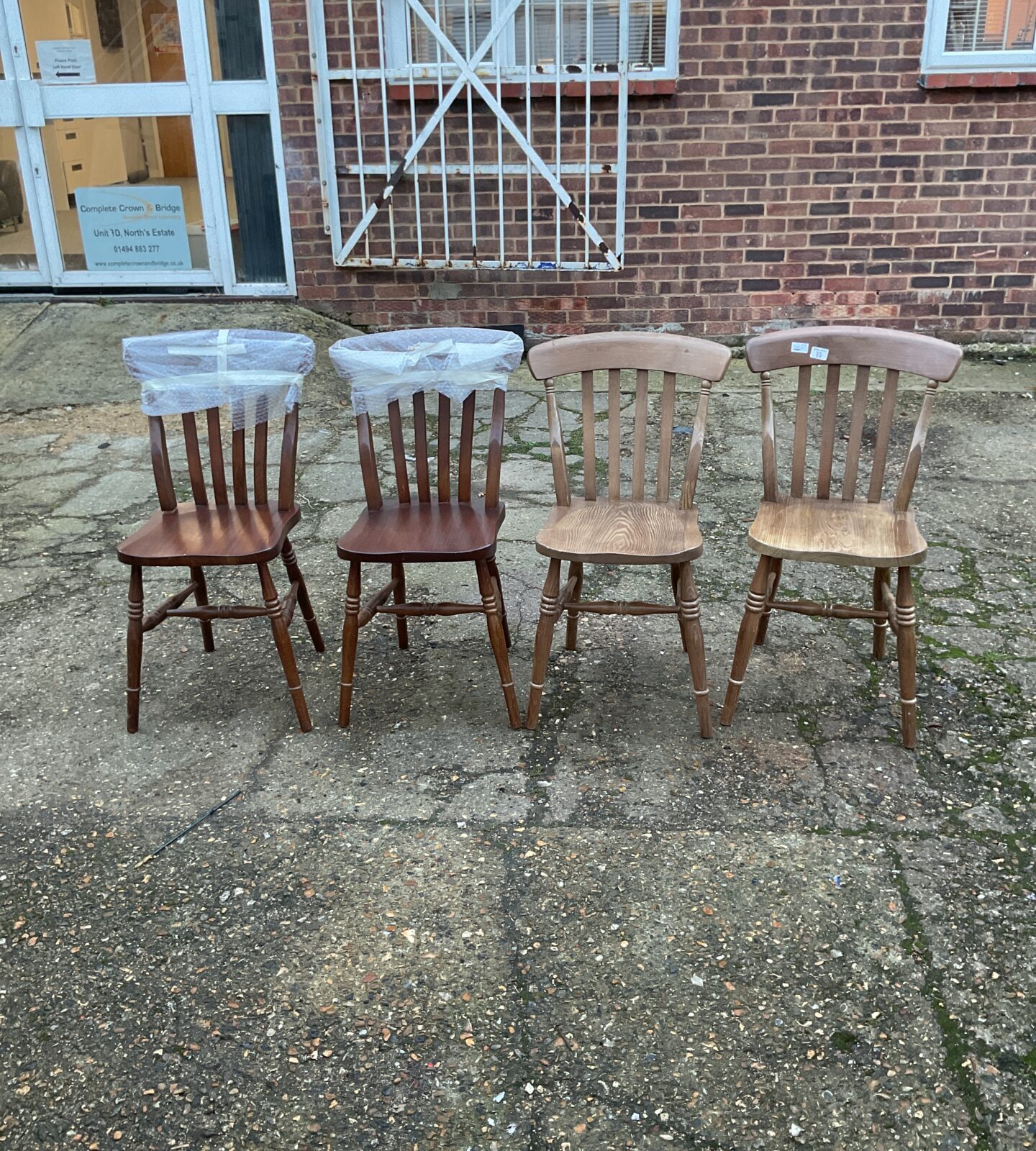 Four stick back dining room chairs