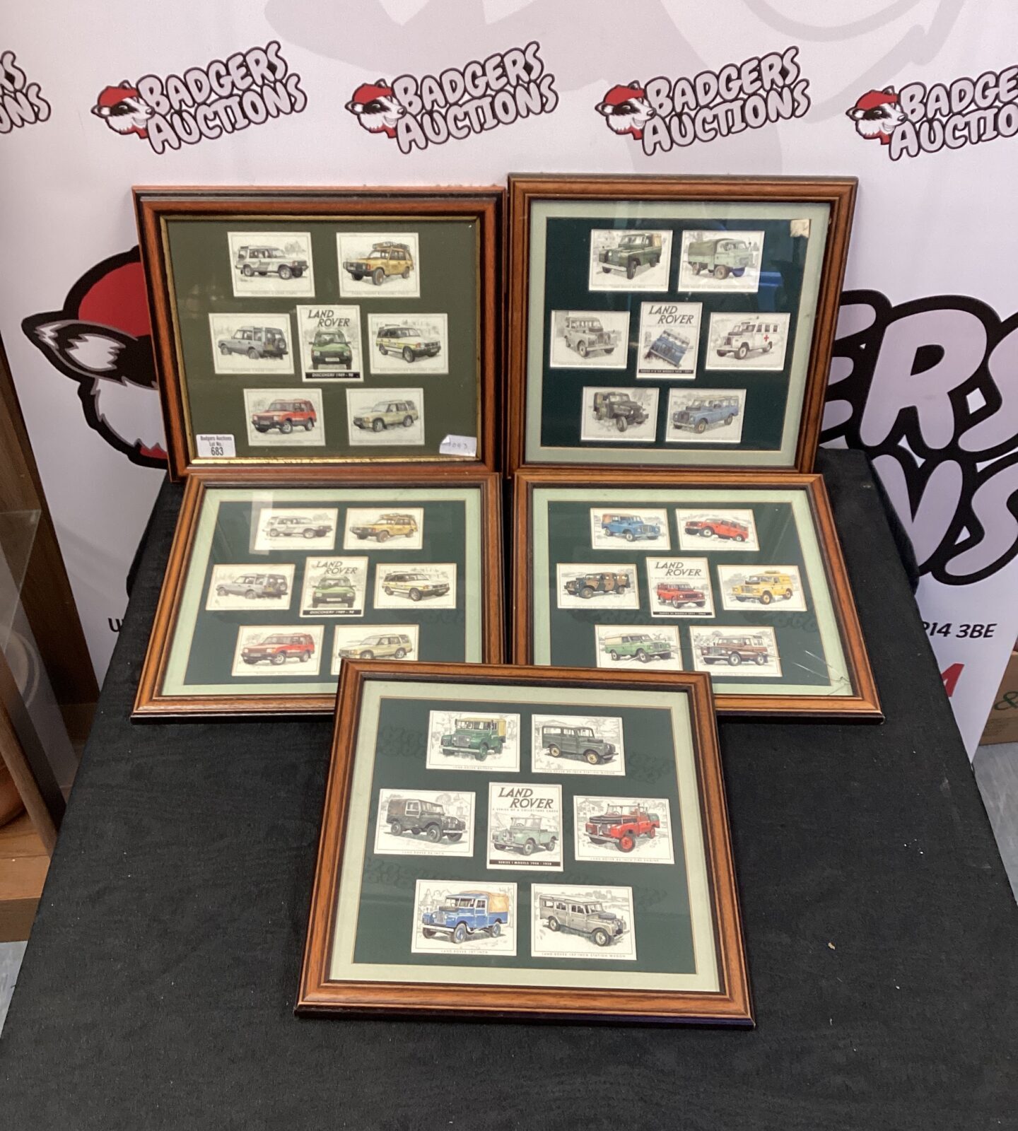 Collection of framed land rover collectors cards