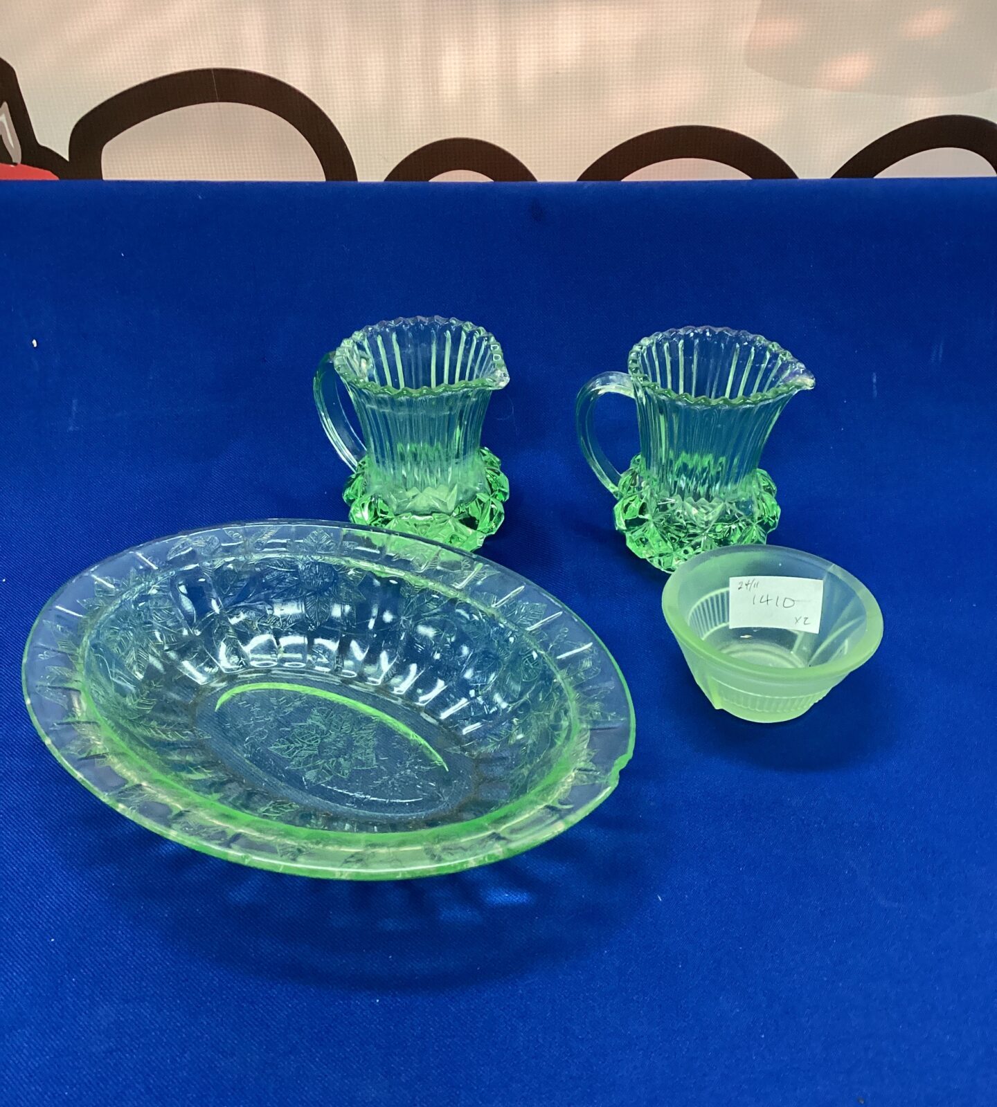 Four pieces of green glass including uranium glass