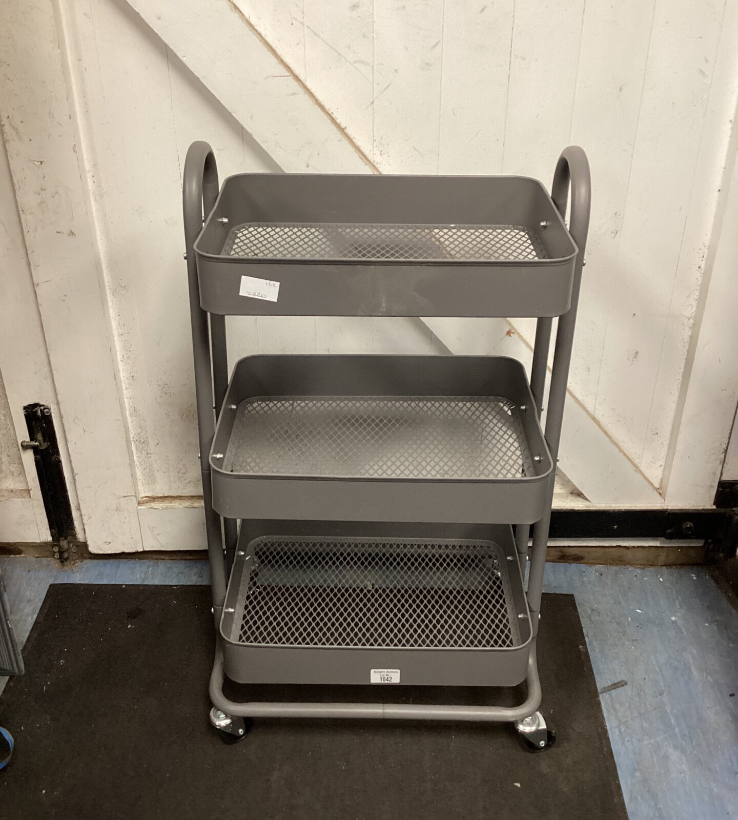 Three tier metal trolley on wheels