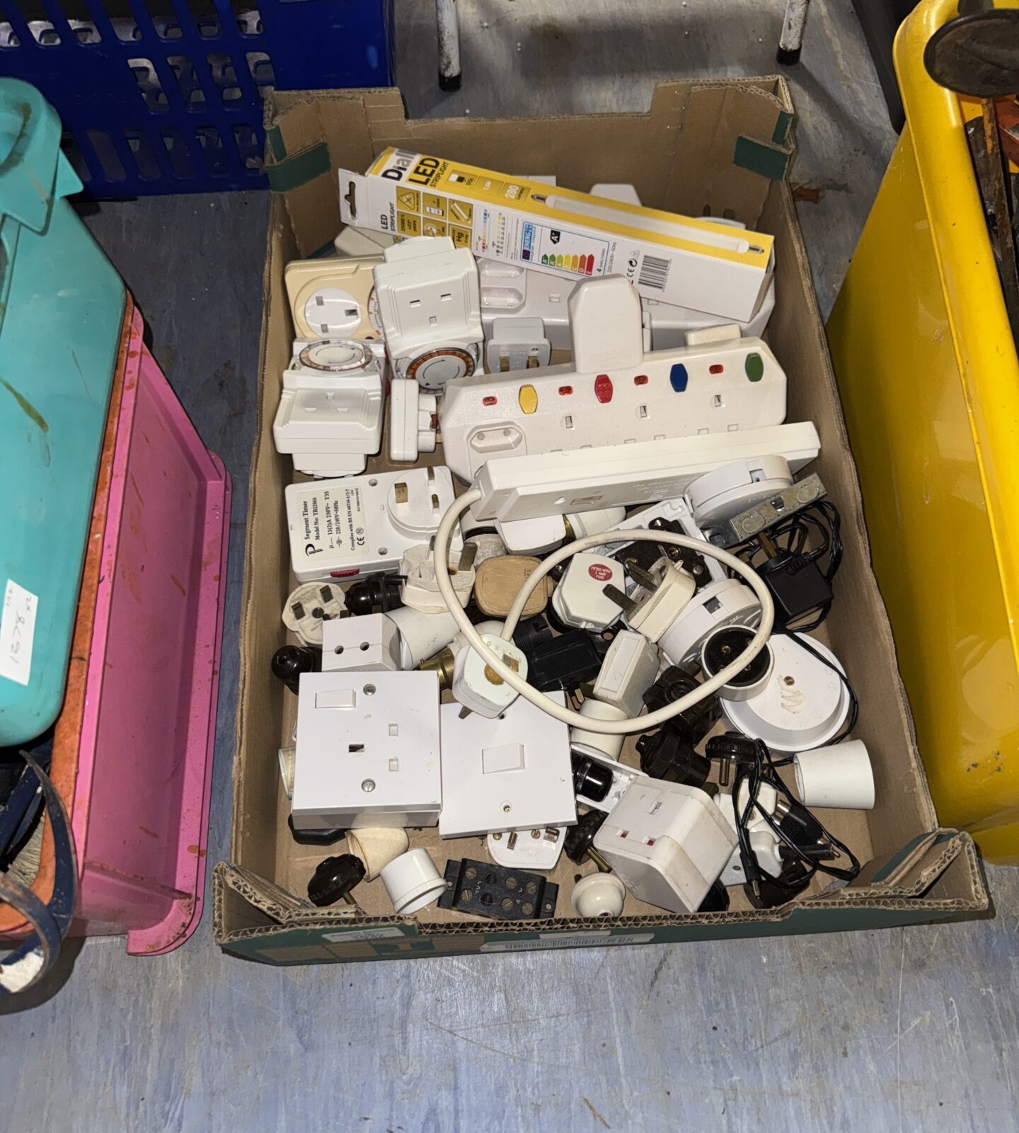 Box of plug sockets, timers & adapters