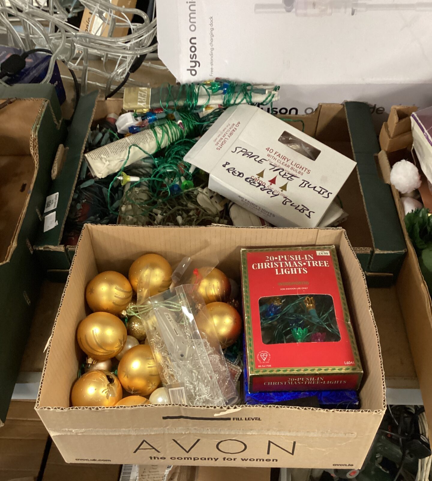 Two boxes of Christmas decorations including lights & baubles