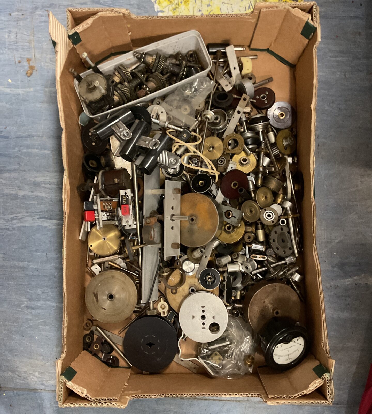 Box of cogs, gears and guages