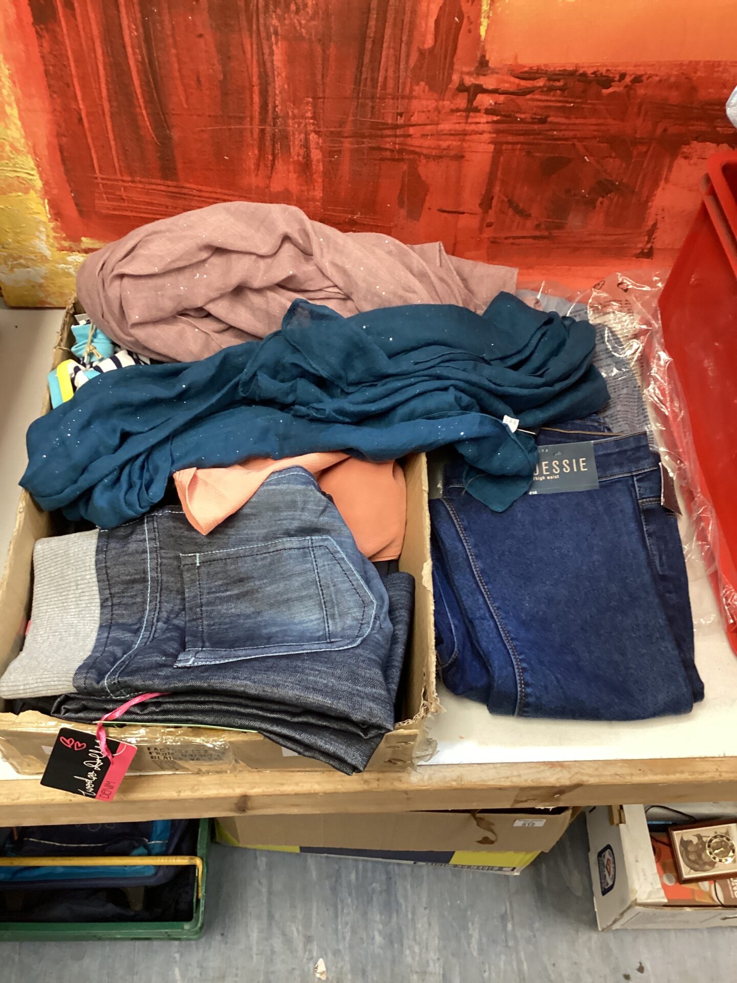 Tray of new clothes inc voodoo dolls jeans, luxe scarves & jessie high waste jeans