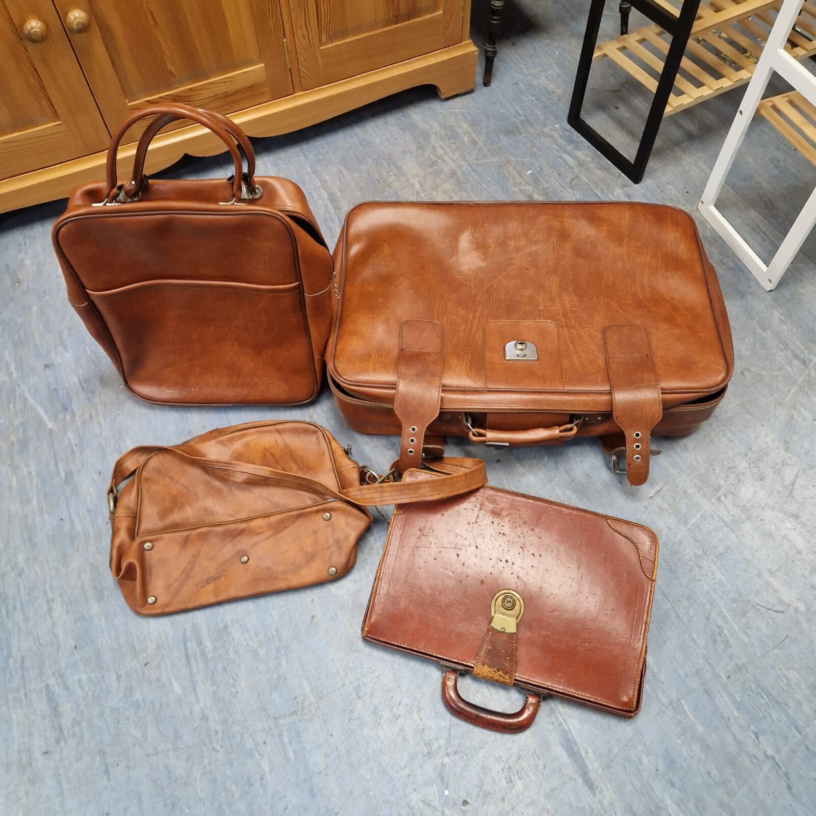 Four brown leather bags inc suitcase, breifcase & shoulder bag