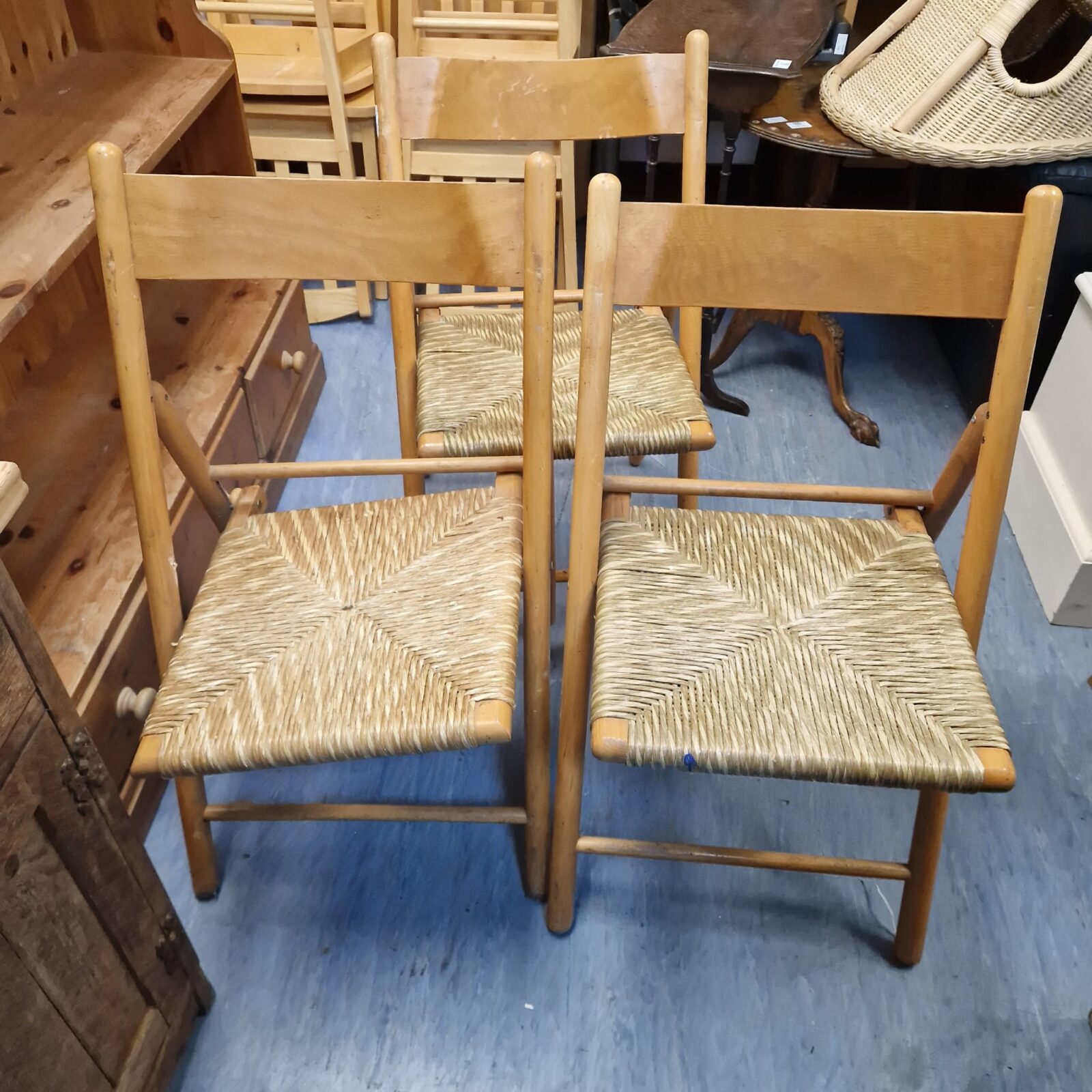 Three woven seated folding chairs for restoration