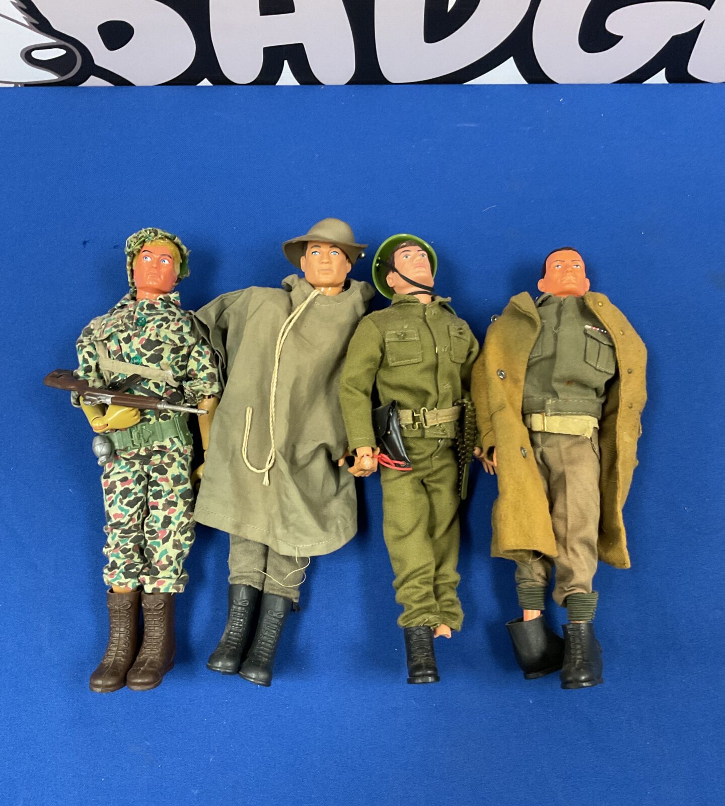 Four 1964 palitoy action man figures with uniforms