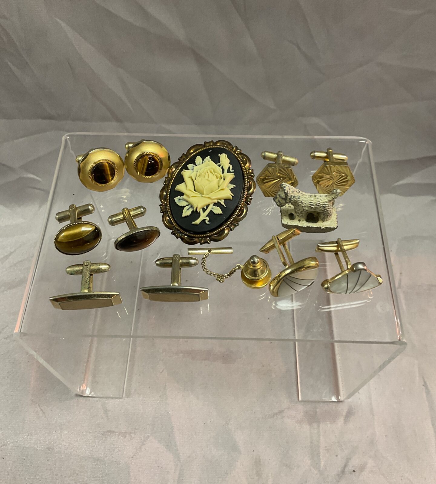 Five pairs of cufflinks a tie pin and brooch