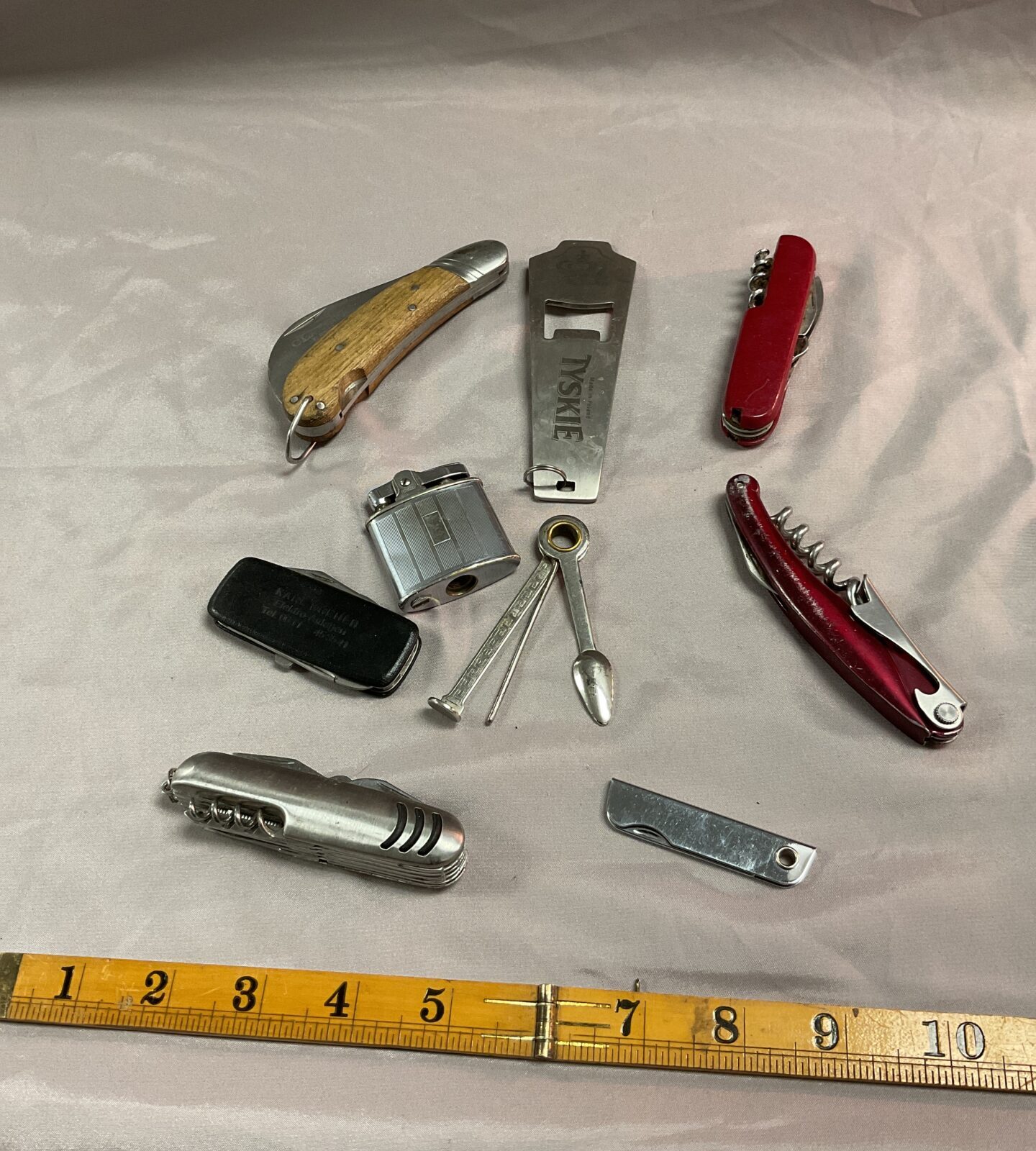 Collection of pocket knives and bottle openers