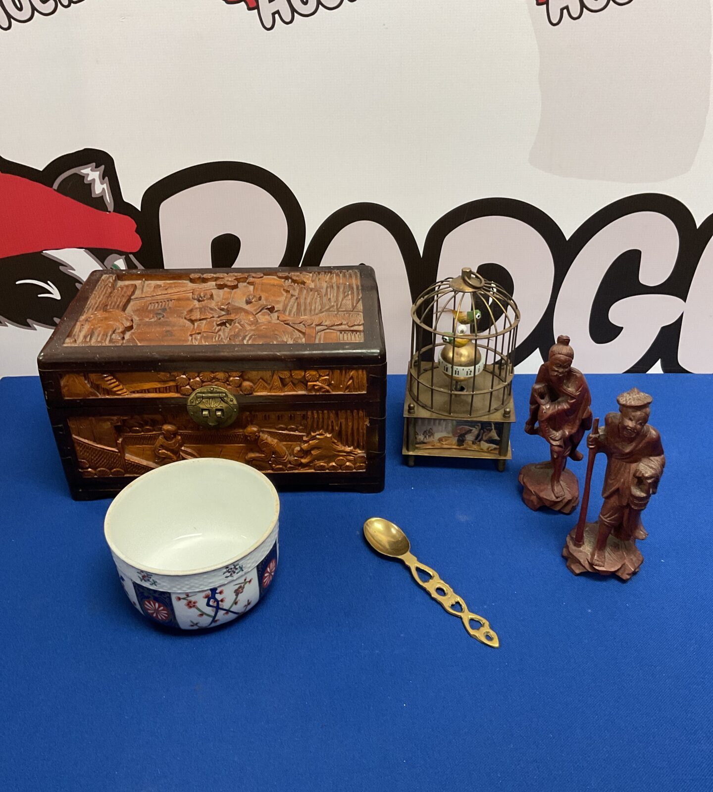 Collection of oriental items including wooden box & clockwork birds in cage