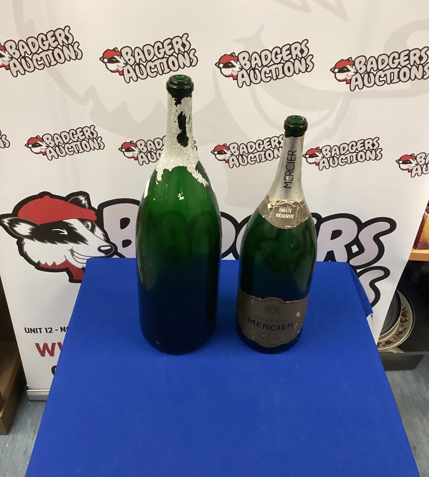 Two large empty Champagne Bottles