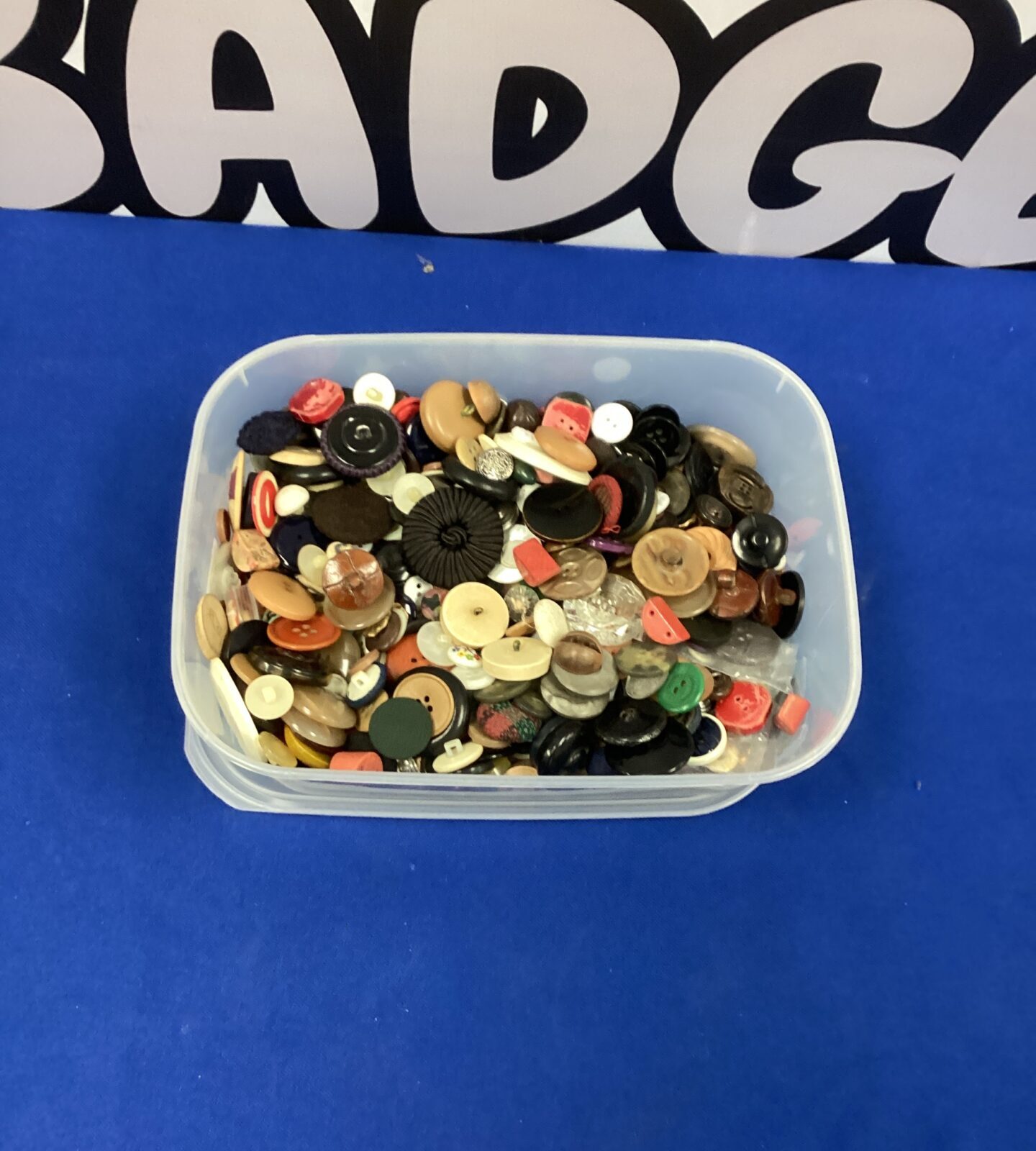 Tub of buttons