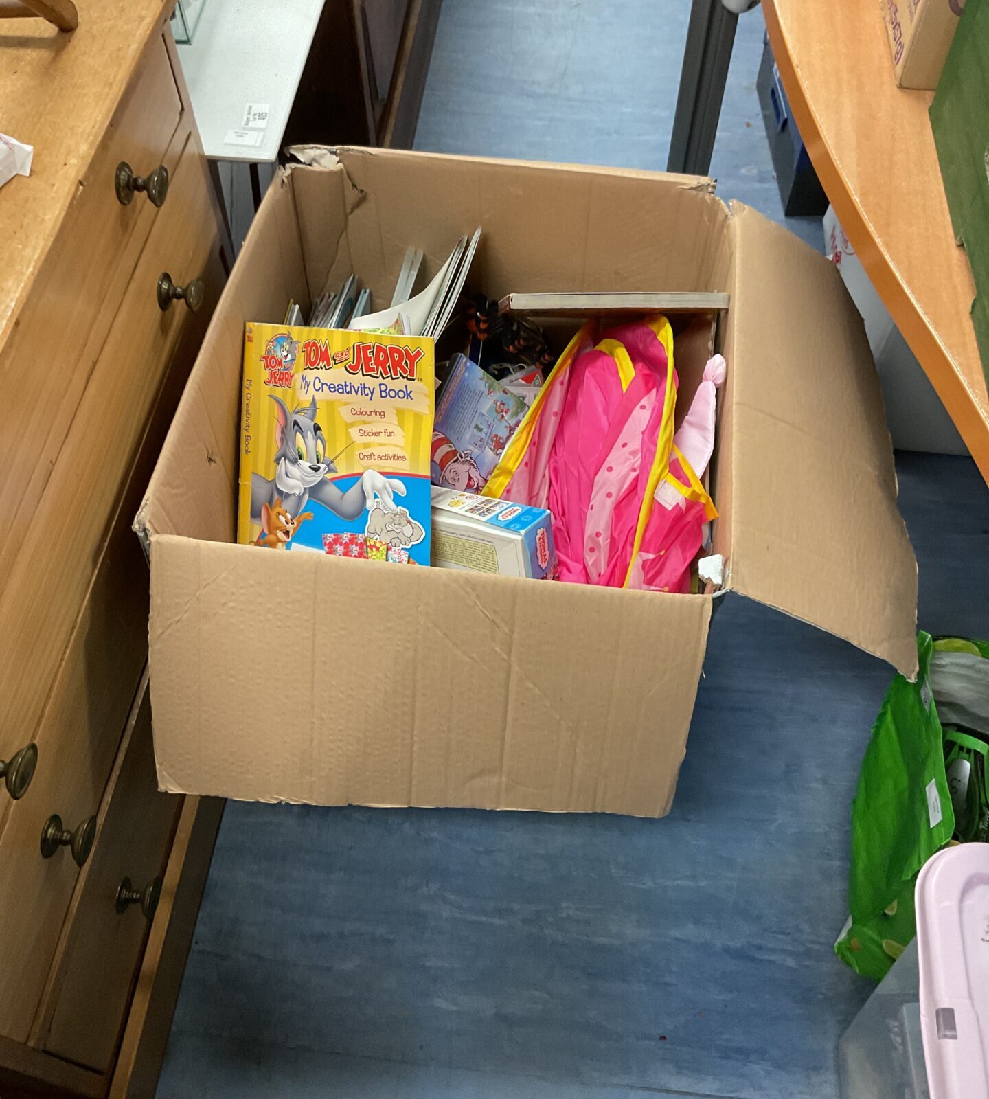 Large box of mixed toys and books