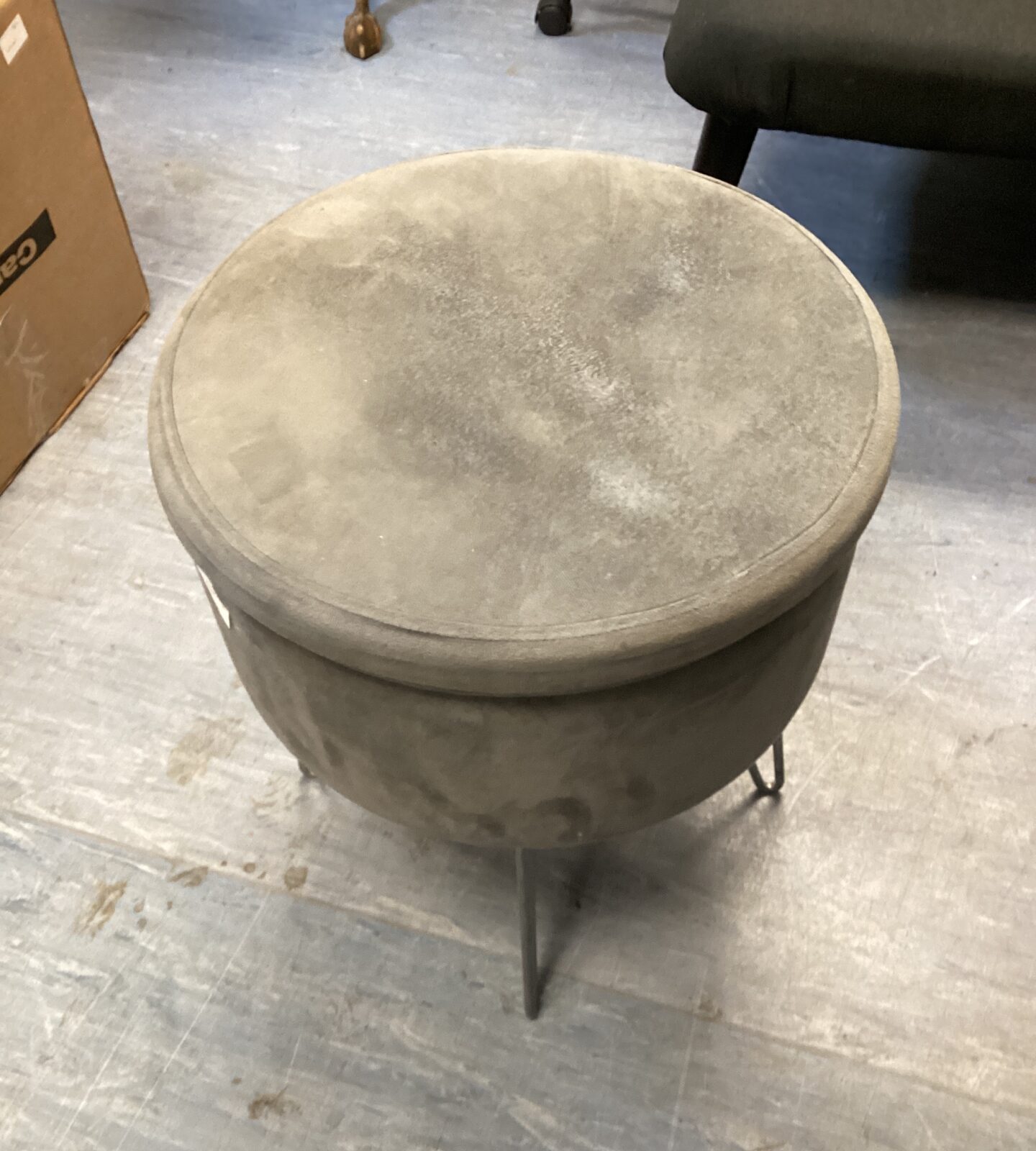 Grey seated stool with storage