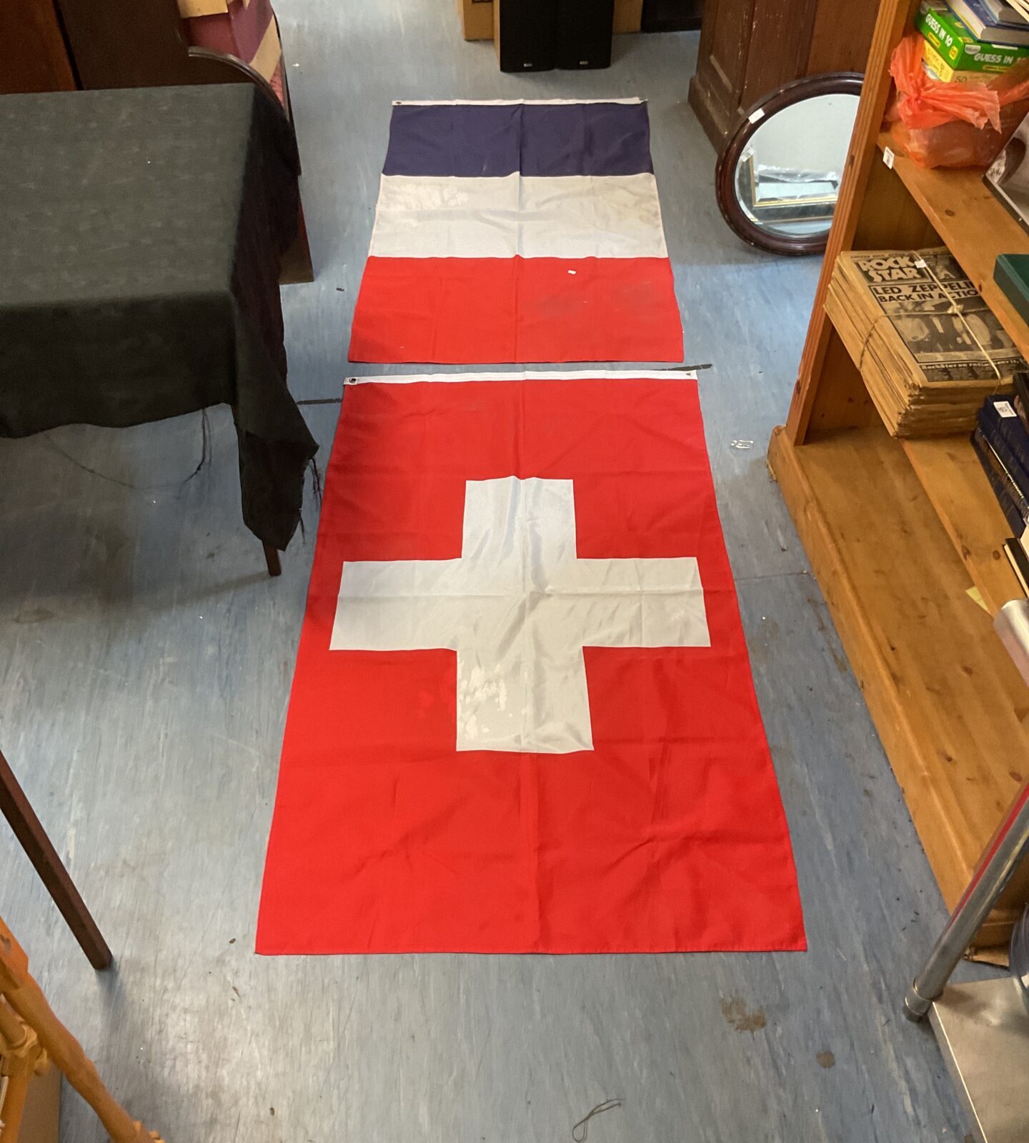 Two large flags inc france and Switzerland