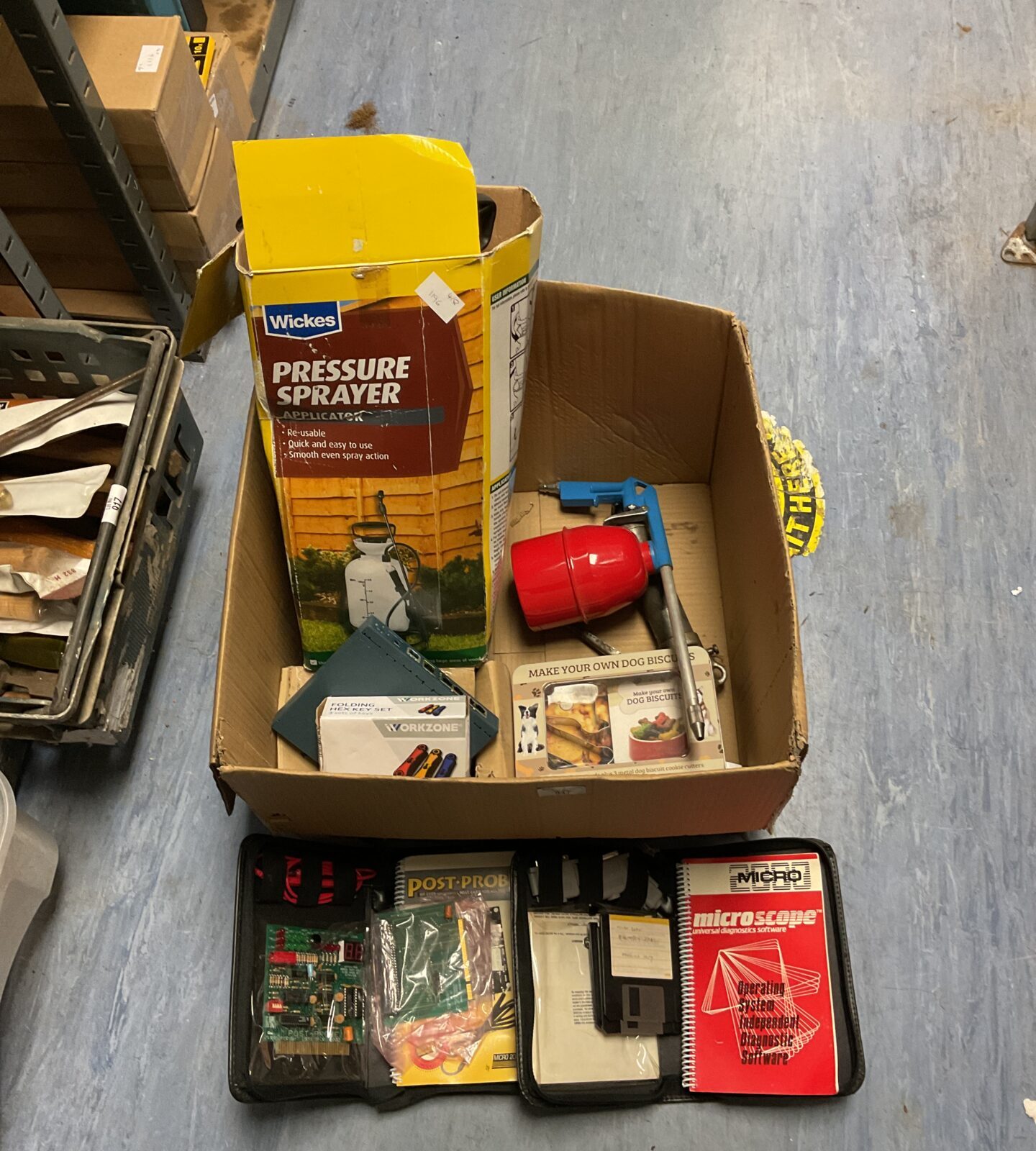 Box of mixed tools including pressure sprayer